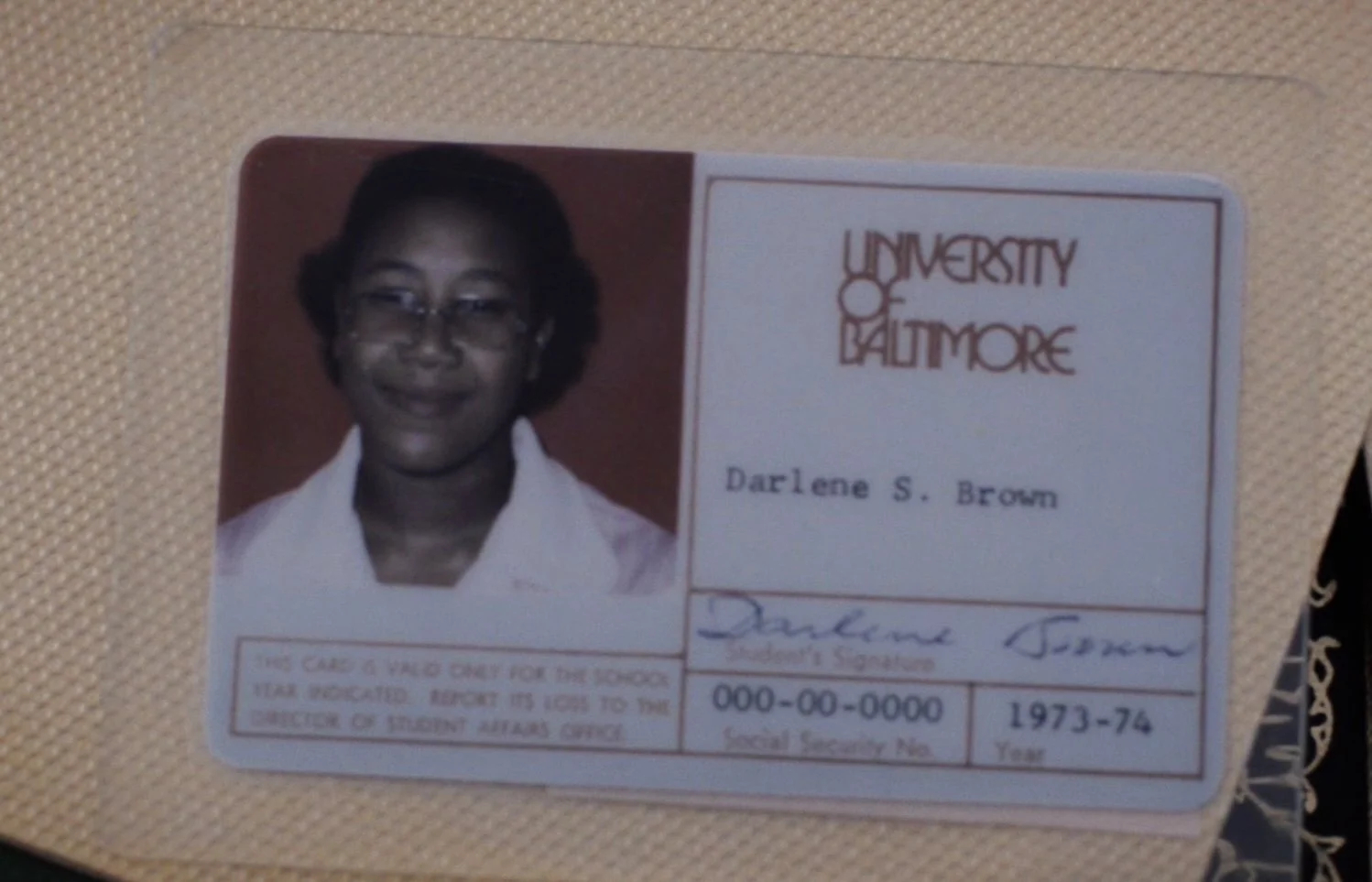Student ID card from University of Baltimore for Darlene S. Brown, showing her photo, name, academic year 1973-74, and signature.