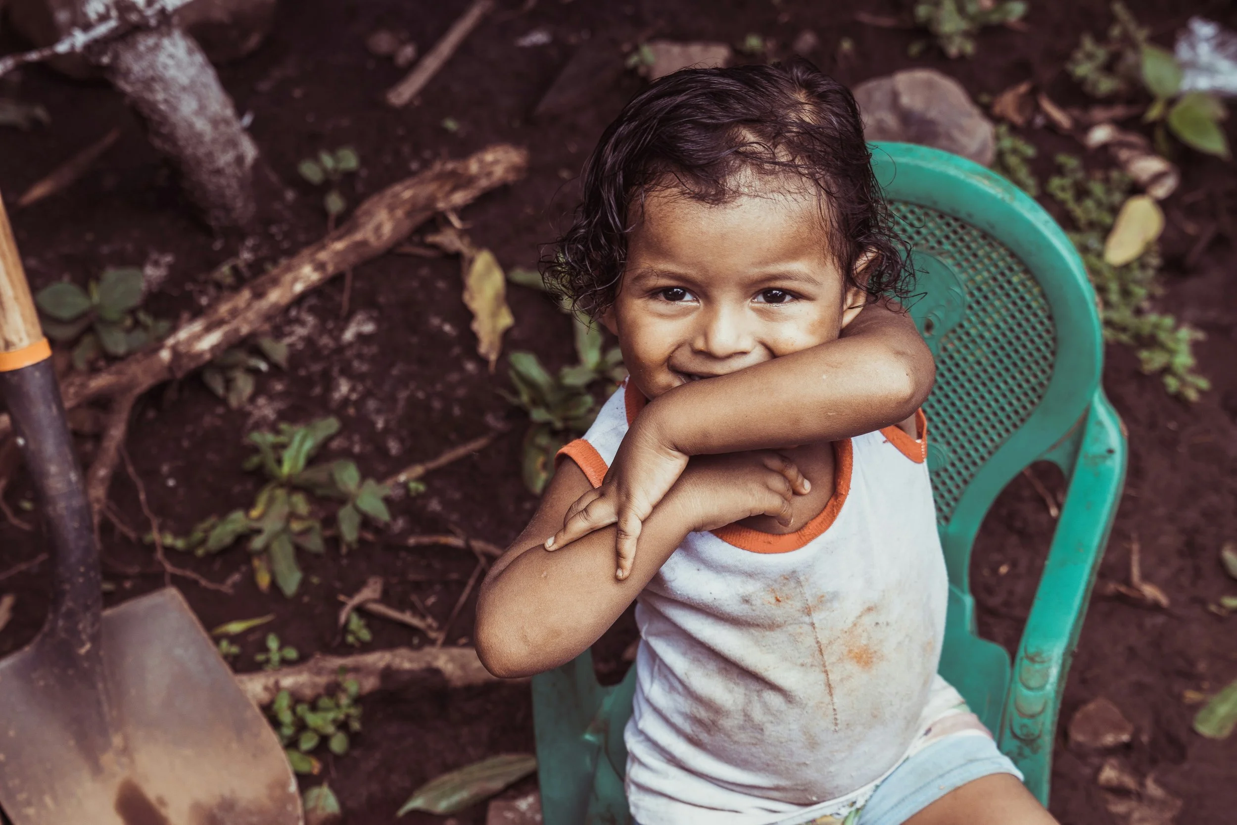 Young child in Nicaragua smiling at the camera during a mission trip.