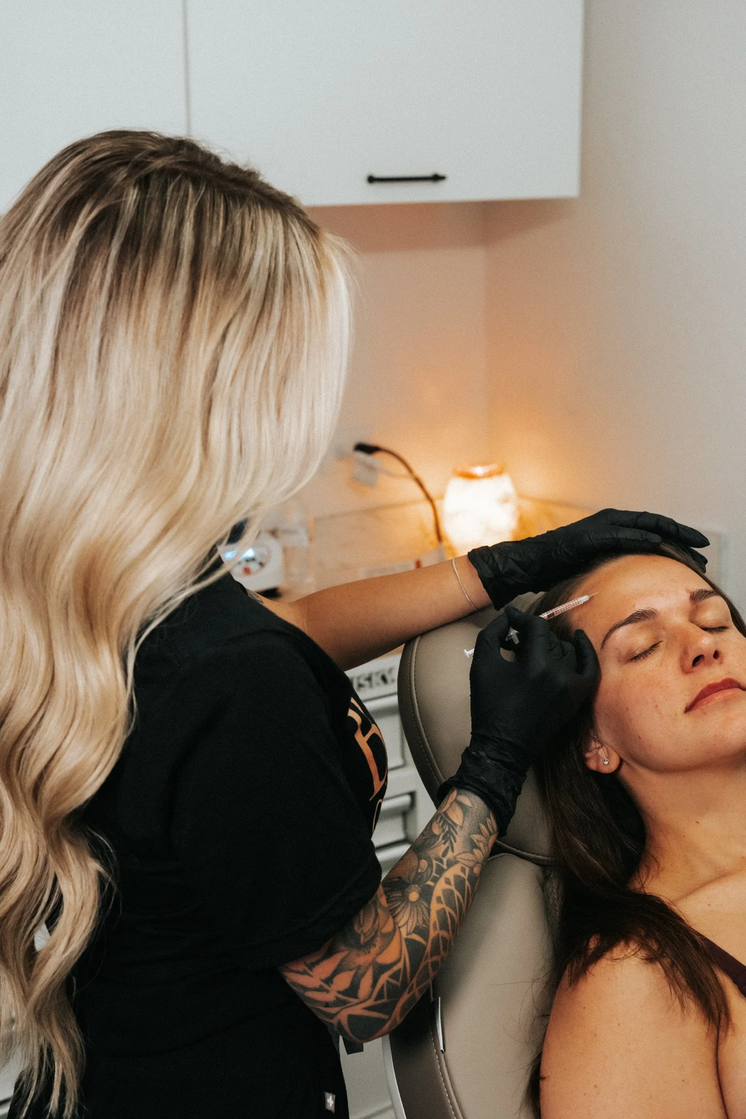 esthetician giving client injectables centennial co