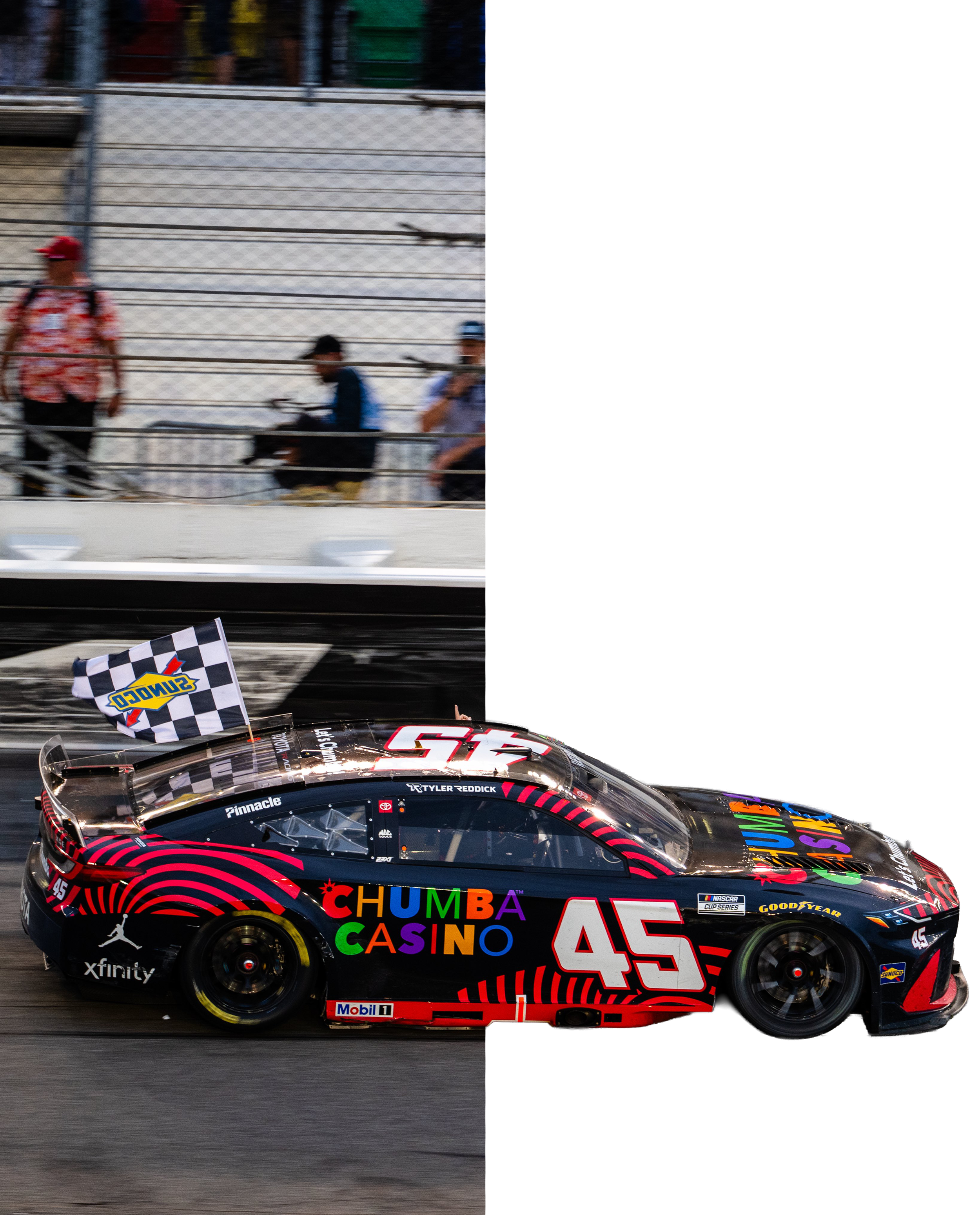 Race car number 45 with colorful sponsor logos, including 'Chumba Casino', crossing the finish line with a checkered flag, on a race track.