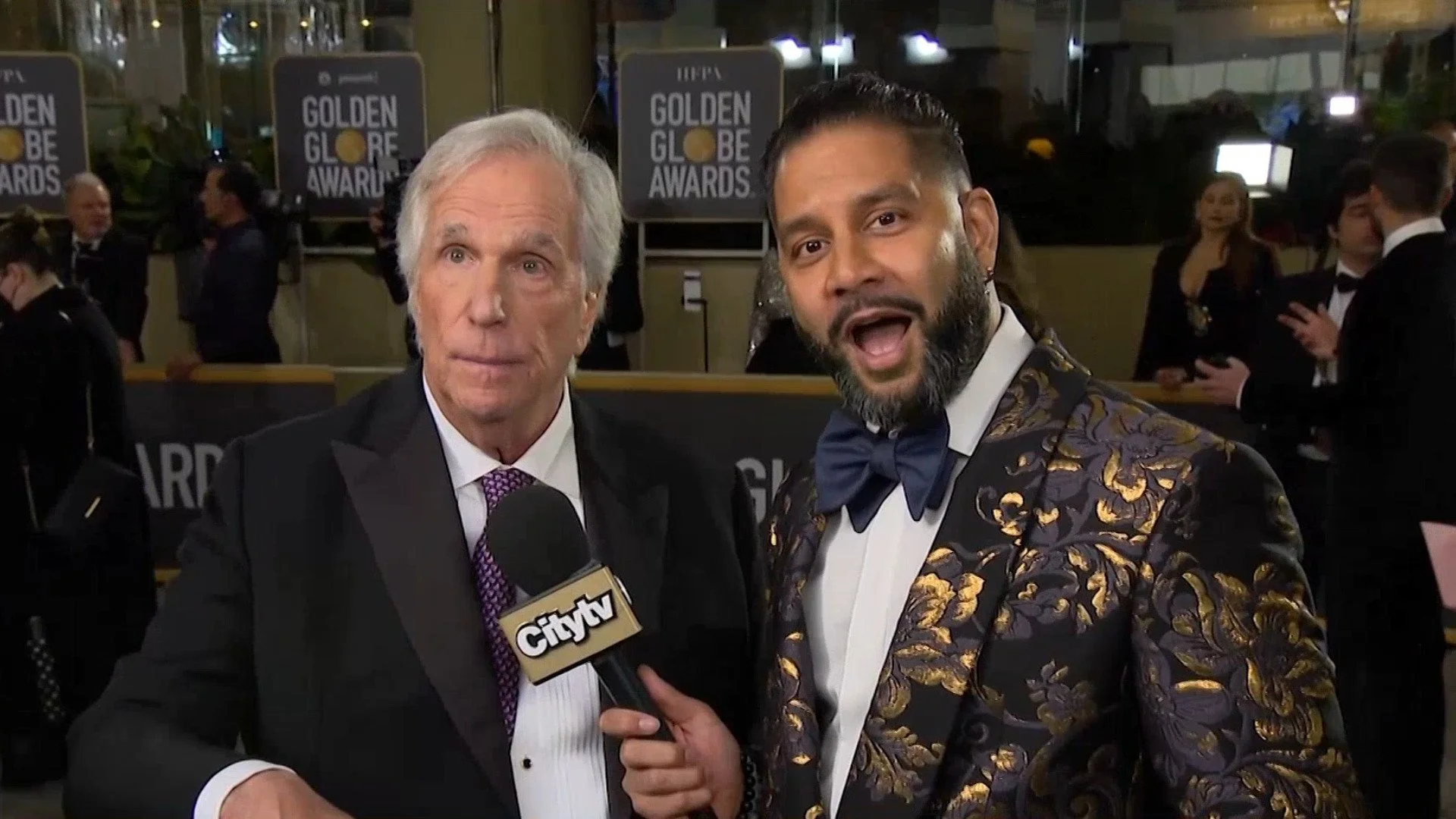 3. Devo Brown hosting an interview at a live entertainment event at Golden Globe Awards