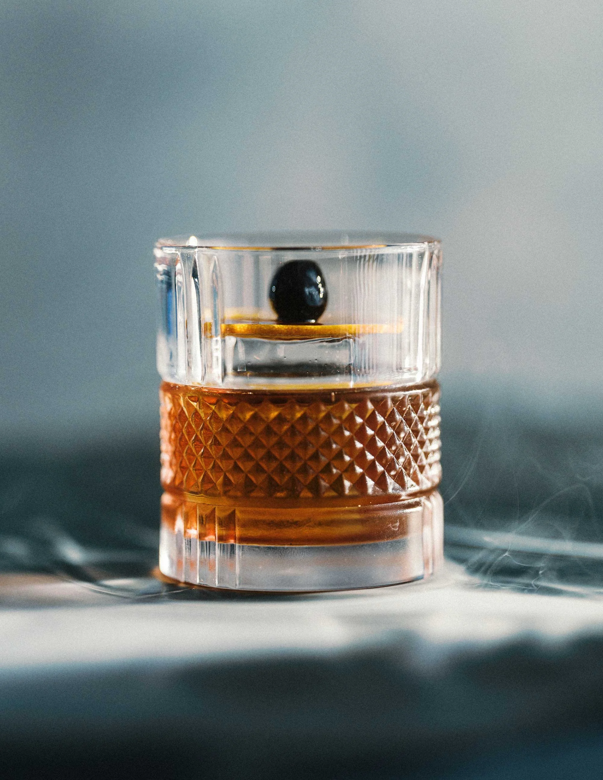 old fashioned cocktail in a rocks glass with garnish