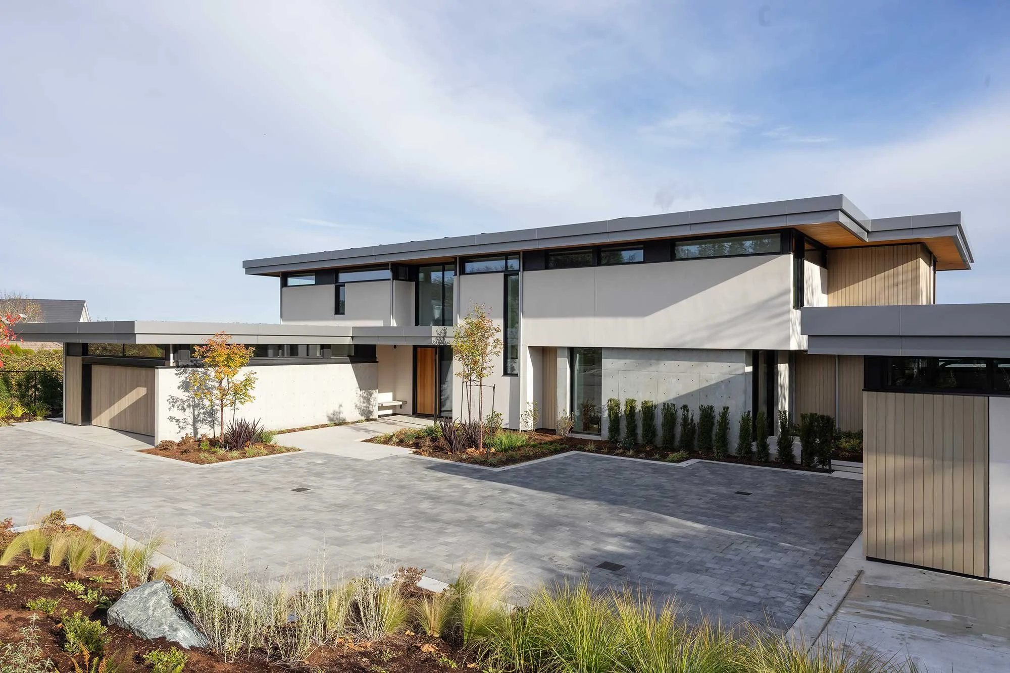 Project photo of a beautiful ocean front home in Victoria, BC with masonry driveway