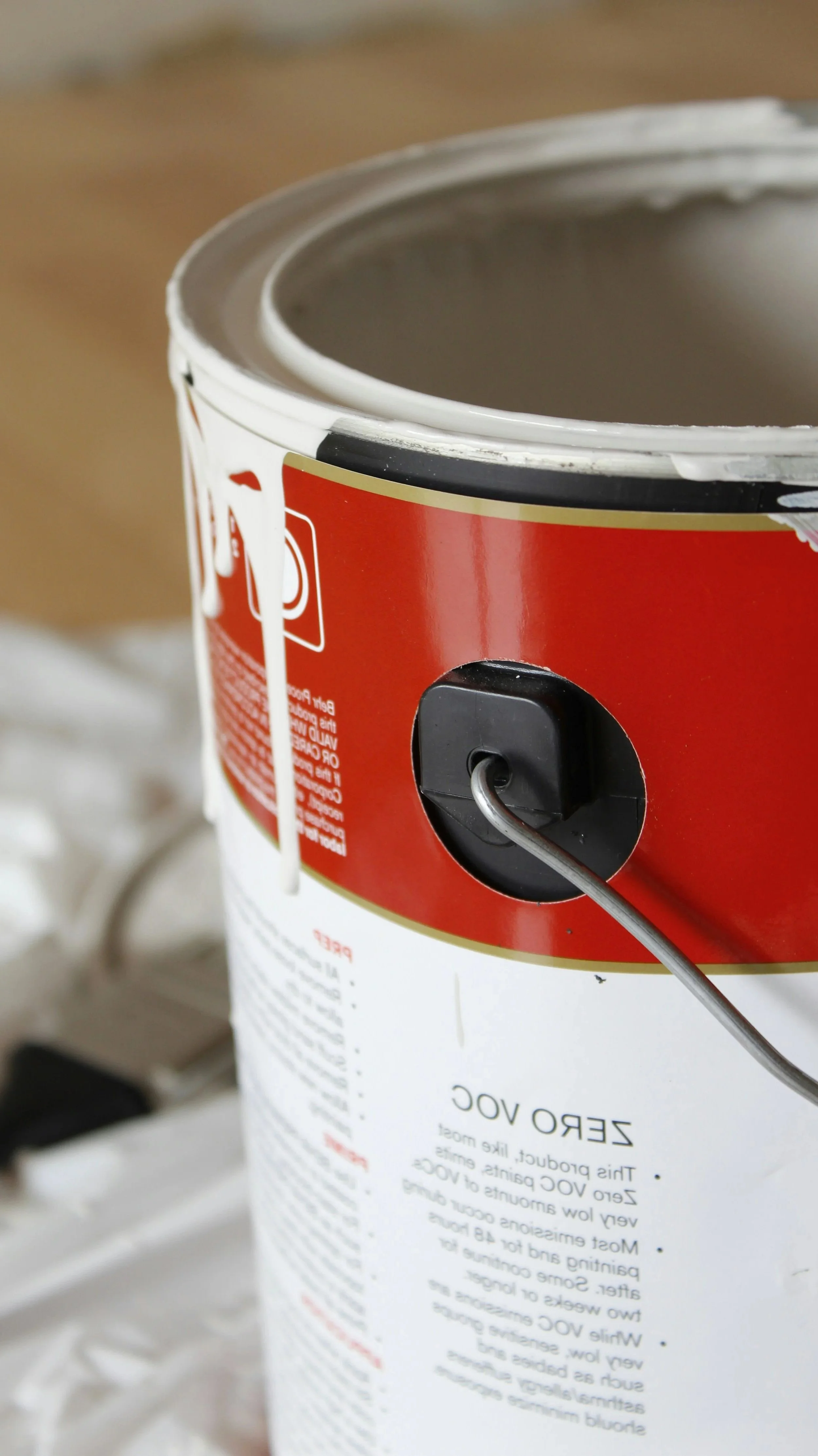 Close-up of a latex paint can with a tap attached for easy pouring.