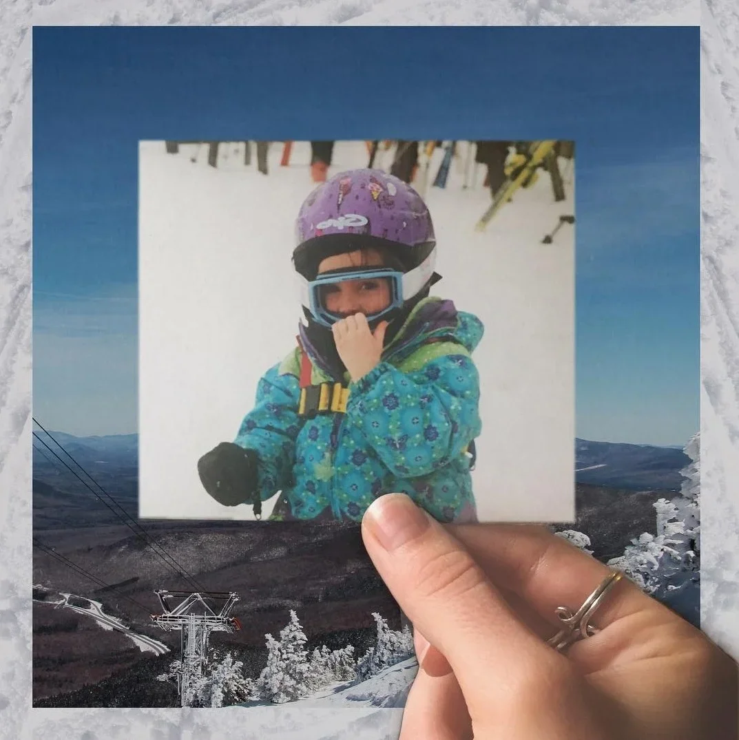 A person holding a photograph of a child wearing ski gear, including a purple helmet and goggles, against a snowy mountain landscape background.