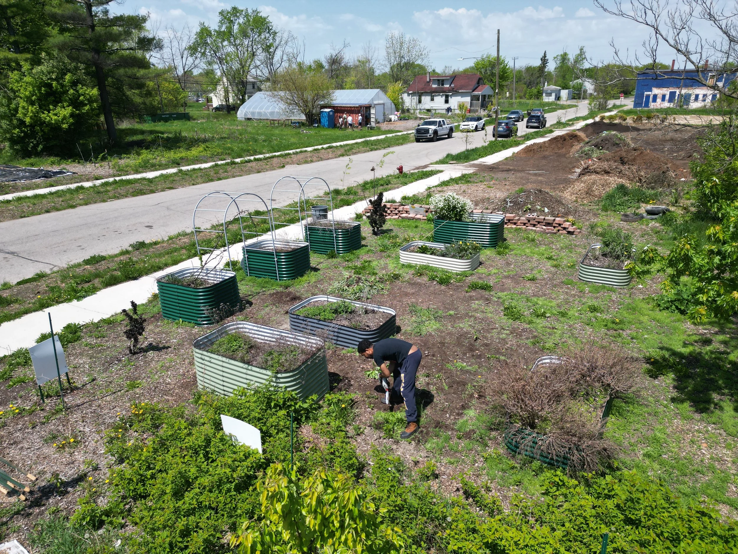 A person working at Sanctuary Farms in the Riverbend community of Detroit