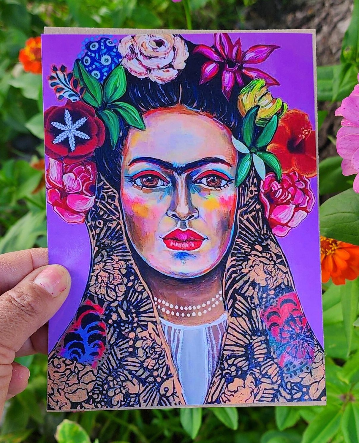 Colorful portrait painting of a woman with flowers in her hair, bright makeup, and jewelry, set against a purple background.