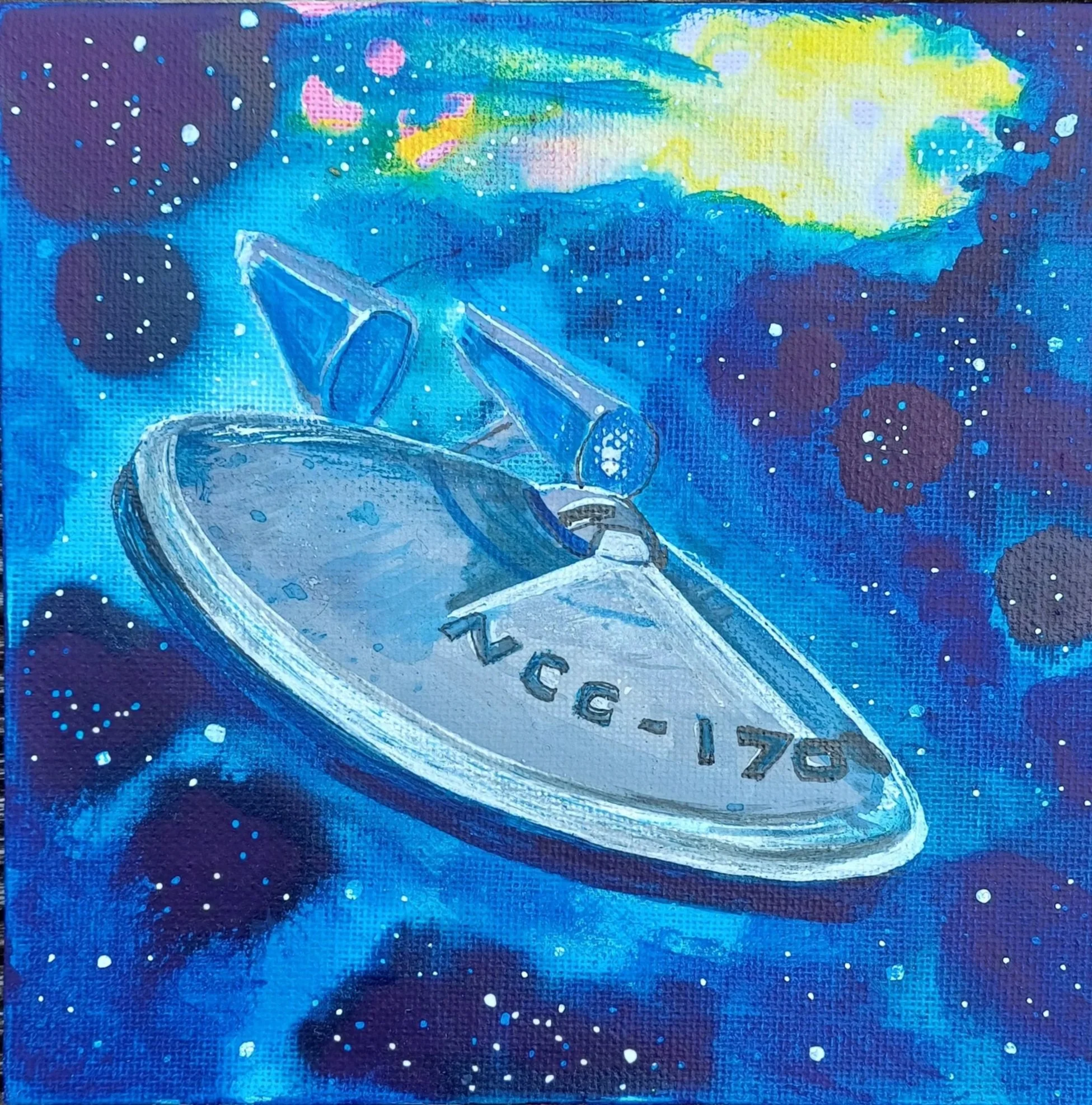 A painted spaceship in space with a blue, purple, and yellow galaxy background. The spaceship has the text 'VGE-170' on its surface.