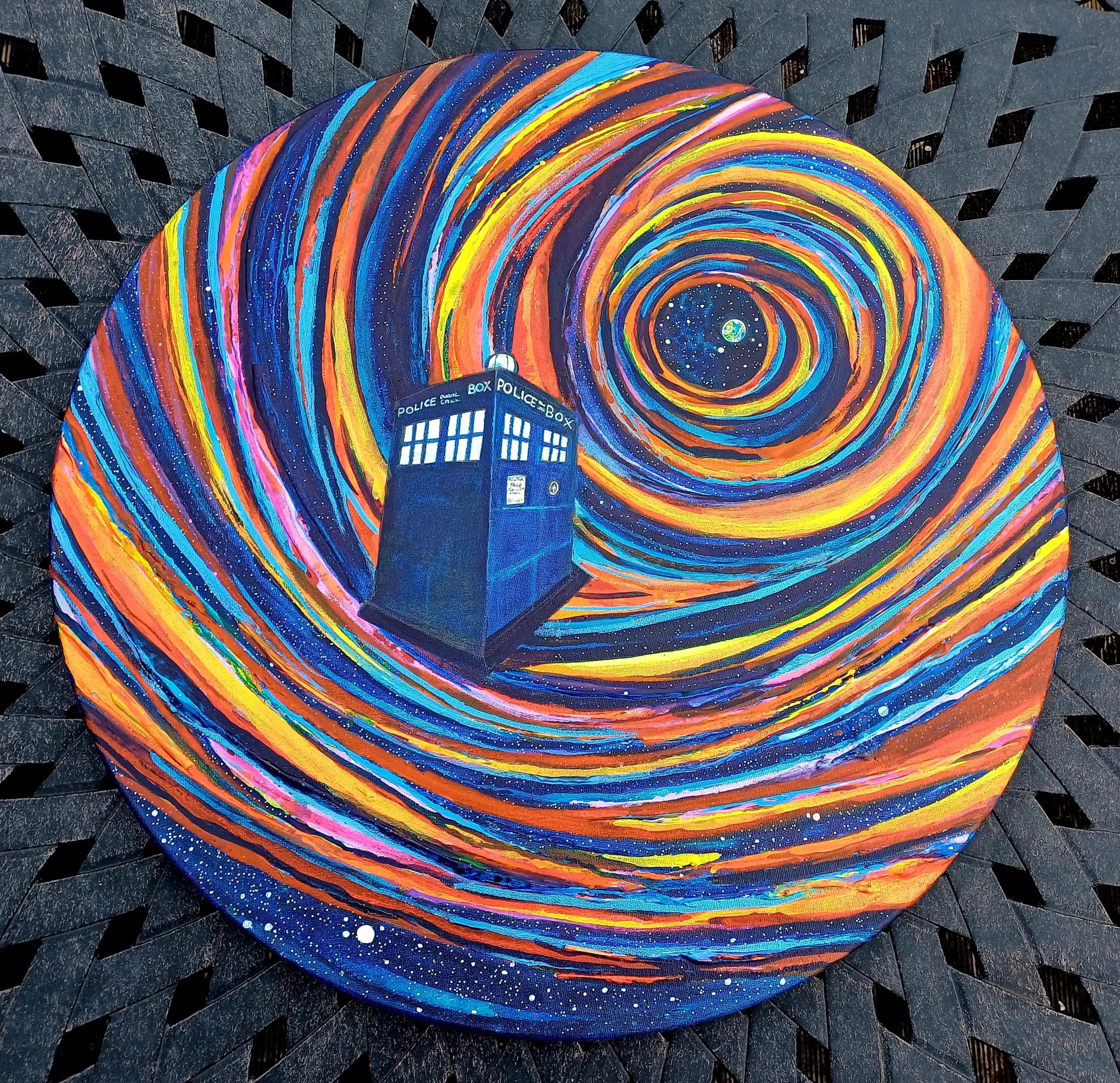 A circular painting depicting the TARDIS from Doctor Who flying through a swirl of colorful, starry cosmic space, resembling Vincent van Gogh's Starry Night.