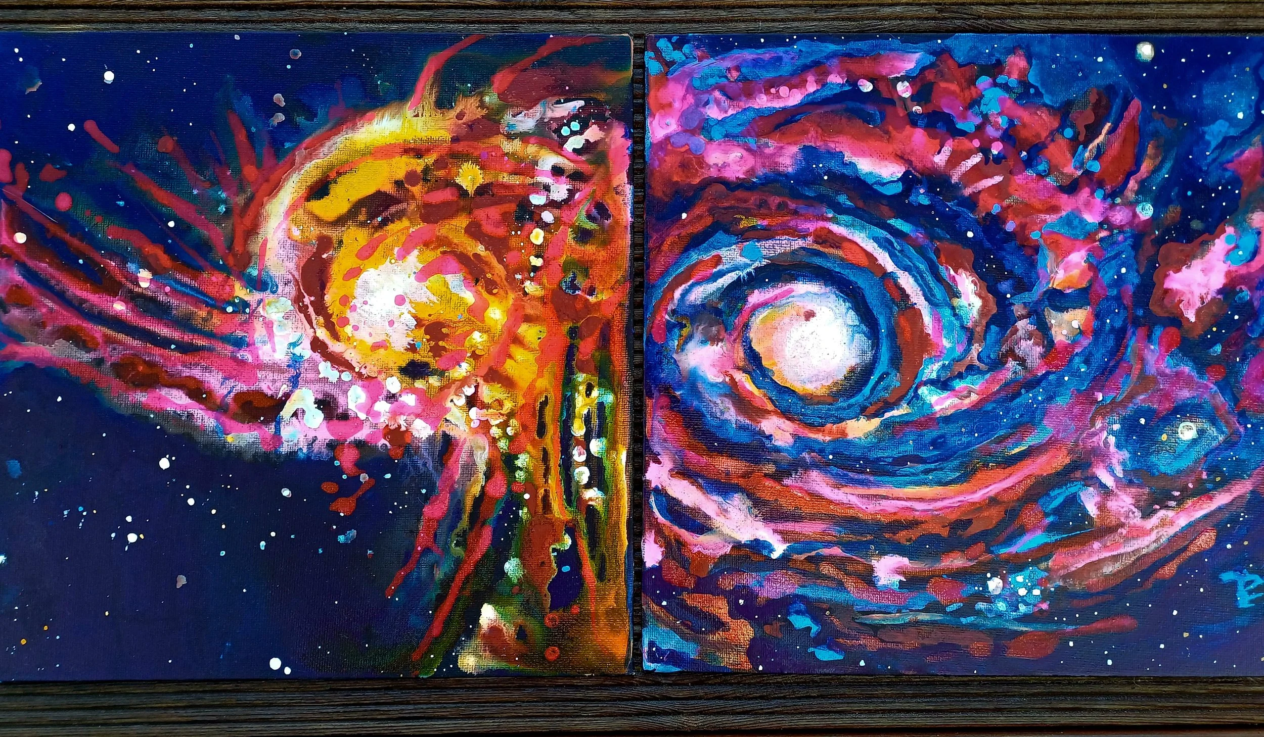 Two abstract paintings of space-themed scenes, each with vibrant colors, swirling patterns, and stars. The left artwork features a bright yellow and red spiral with a white center, while the right artwork shows a swirling galaxy with a bright center surrounded by pink, blue, and red hues.