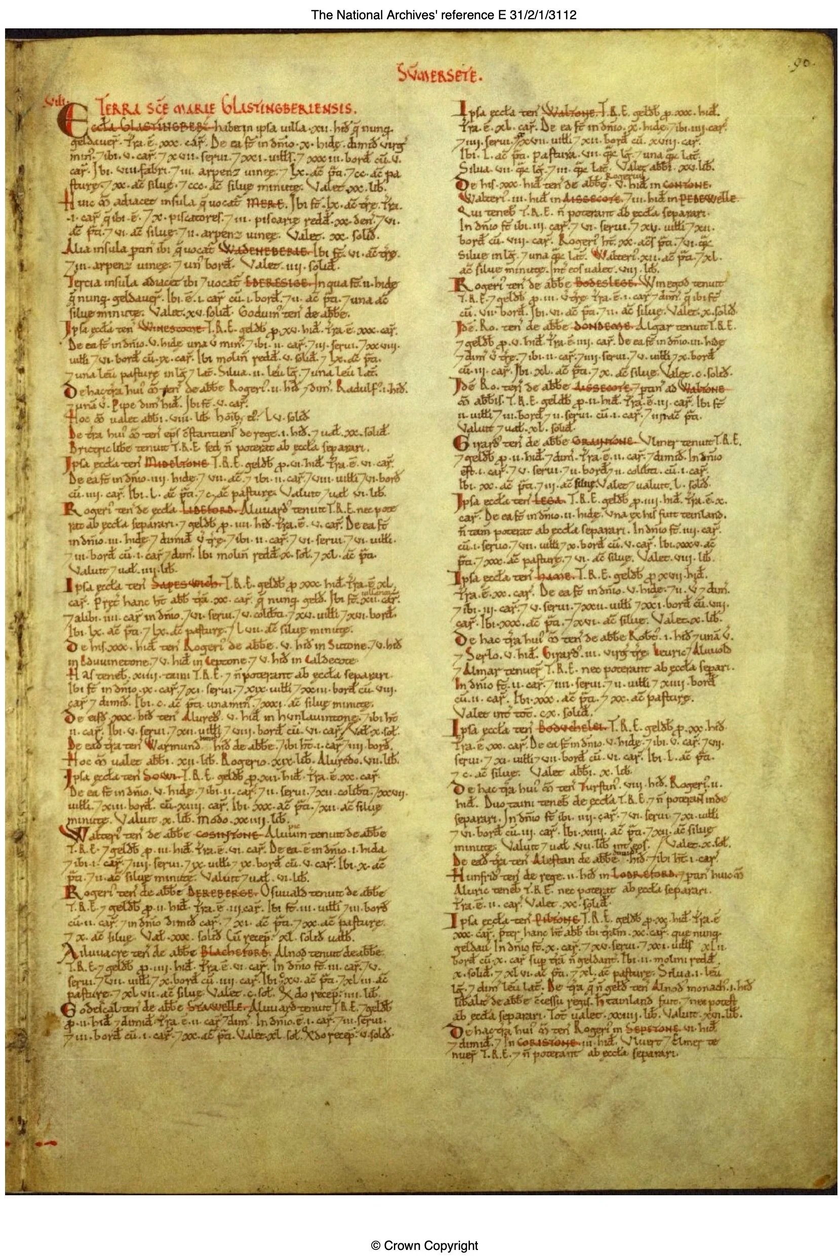An ancient manuscript page with handwritten Latin or old English text in black and red ink, arranged in two columns, with annotations and paragraph symbols.