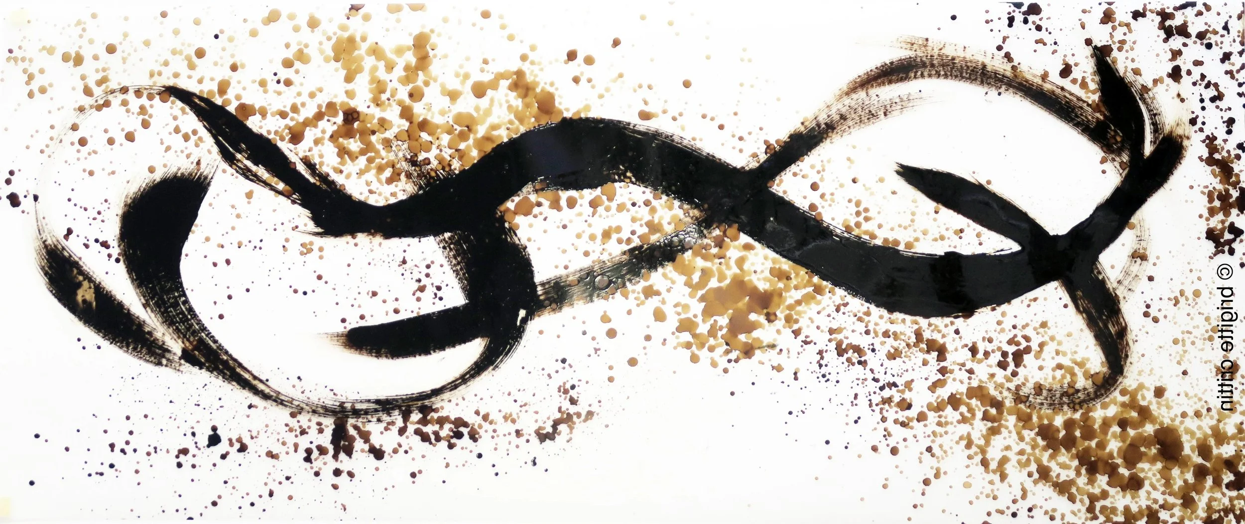 An abstract piece of art featuring black ink strokes forming a continuous, flowing shape on a white background, with scattered beige and black paint splatters.