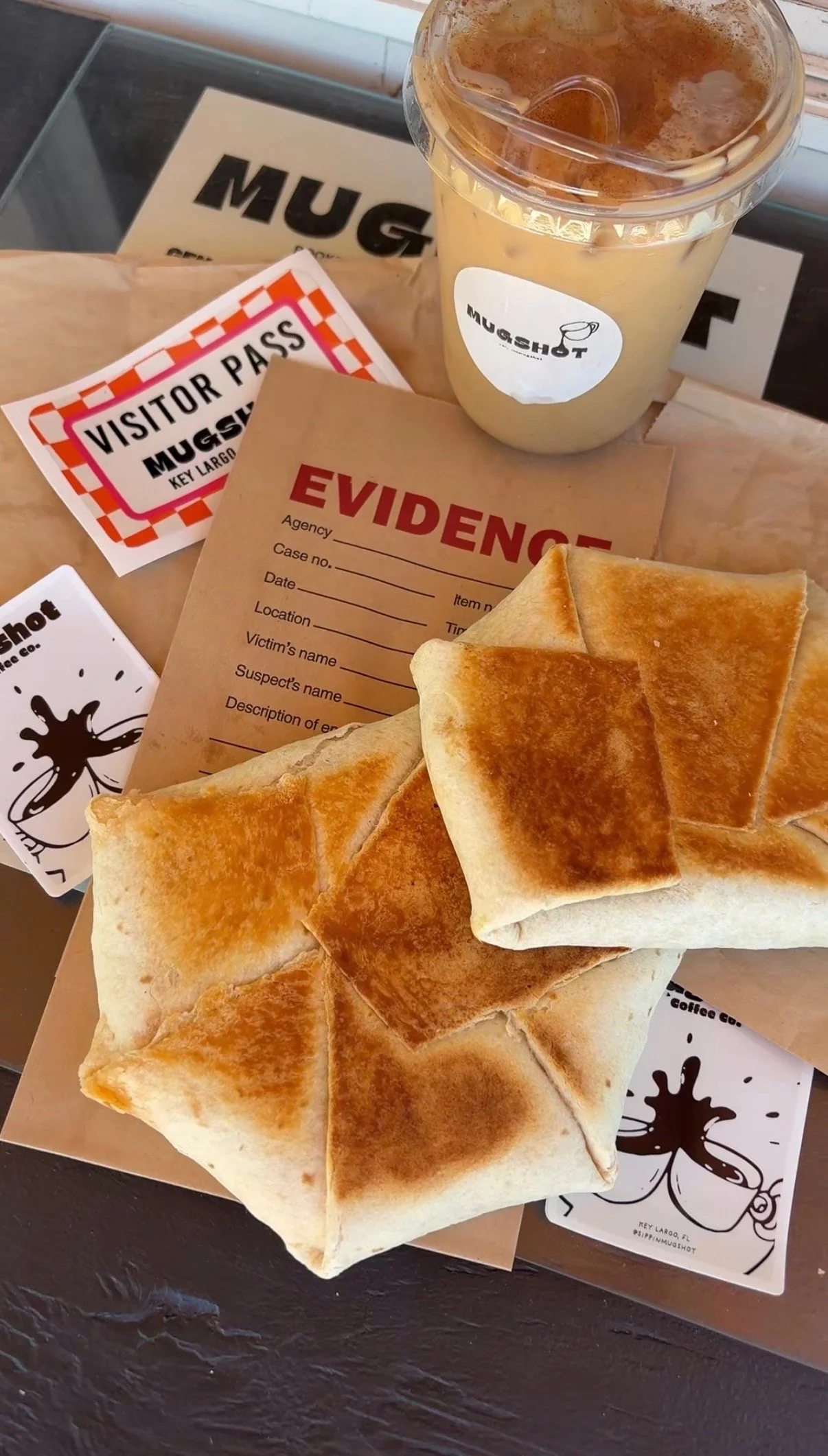 Breakfast crunch wrap and stickers served at Mugshot Coffee Co
