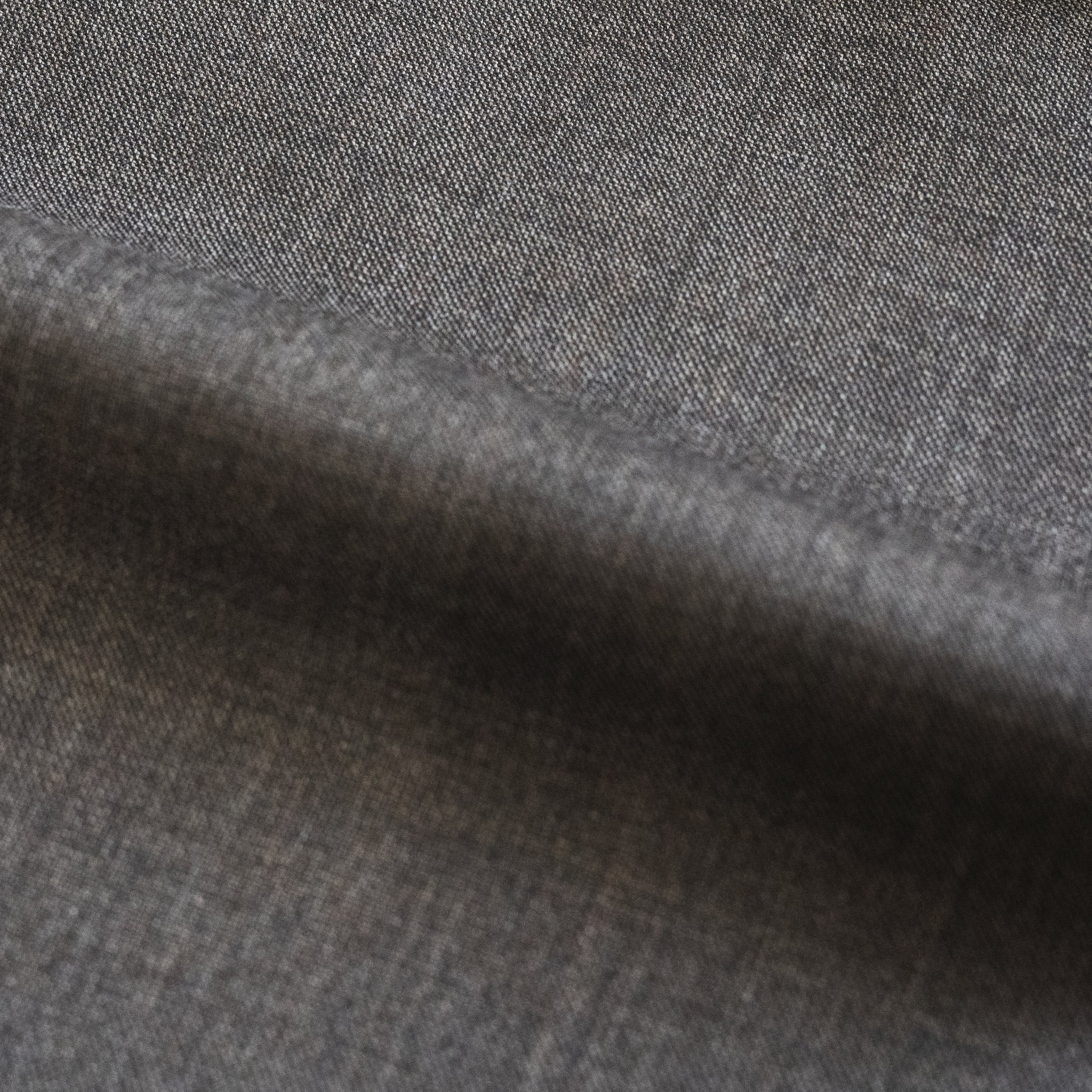 Close-up image of a textured, dark grey fabric surface.