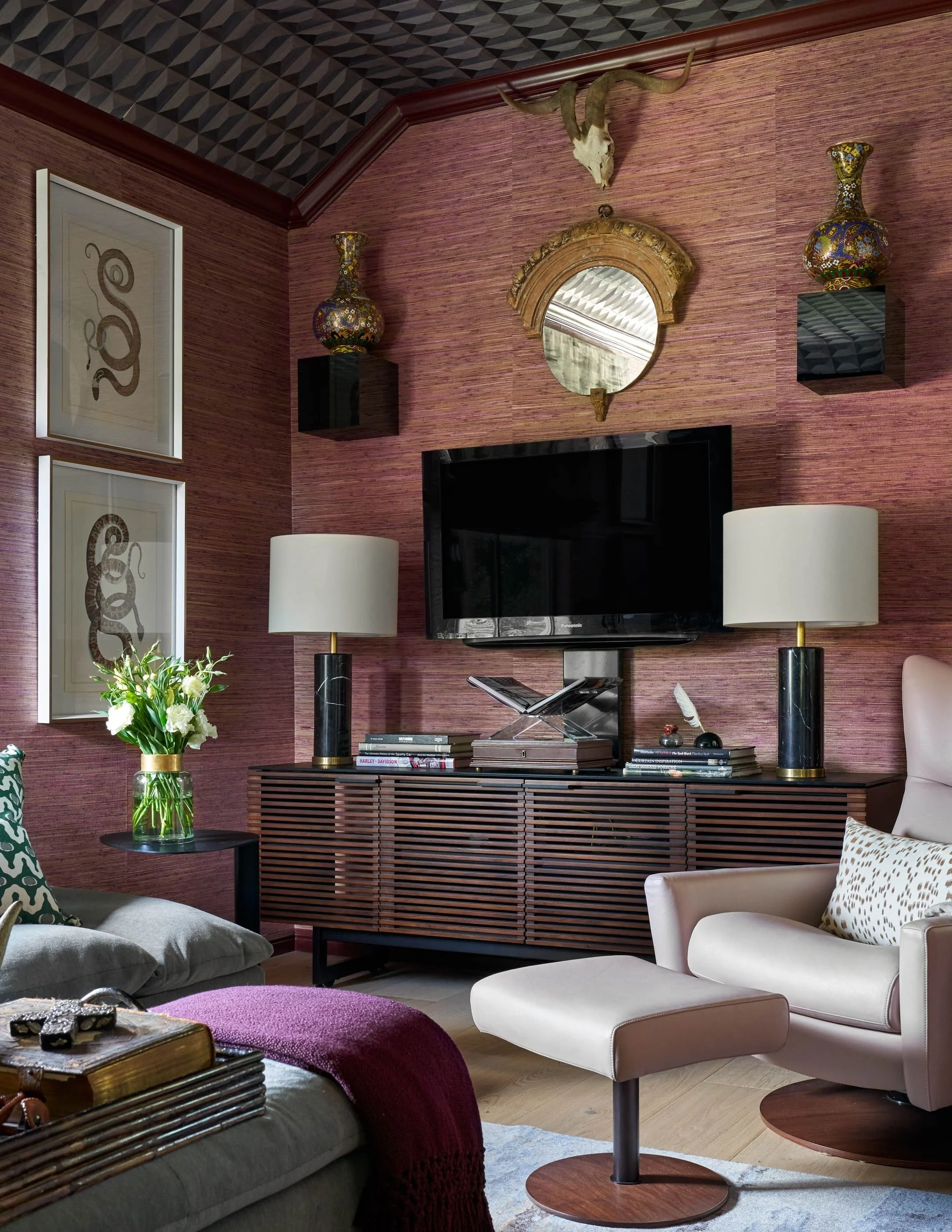 Cozy and colorful living room with eclectic modern furniture features a BDI Corridor Media Cabinet below flatscreen tv mounted on wall