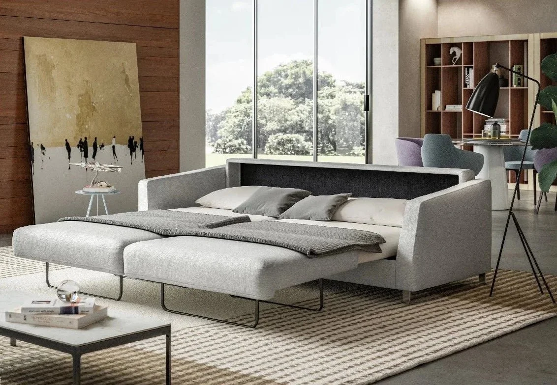 Modern living room with a gray sofa sleeper sofa pulled out into bed mode 