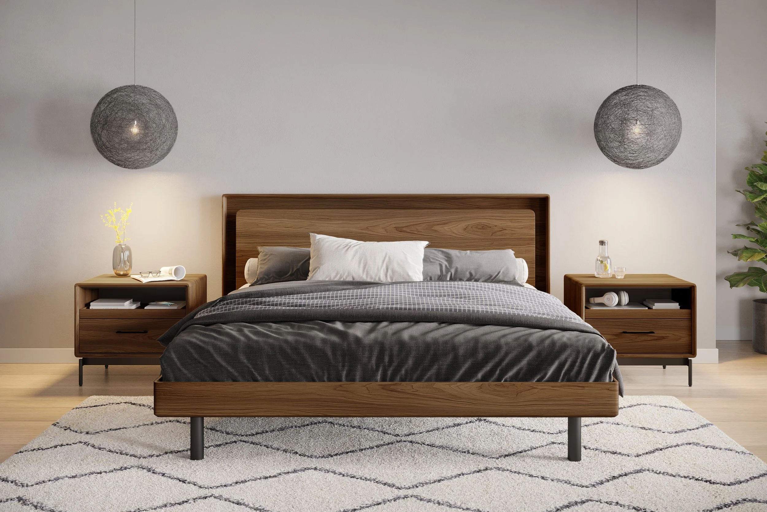 A modern bedroom with a wooden bed, dark gray bedding, two wooden nightstands, hanging spherical pendant lights, a white rug with black diamond pattern, and a plant in a pot on the right.