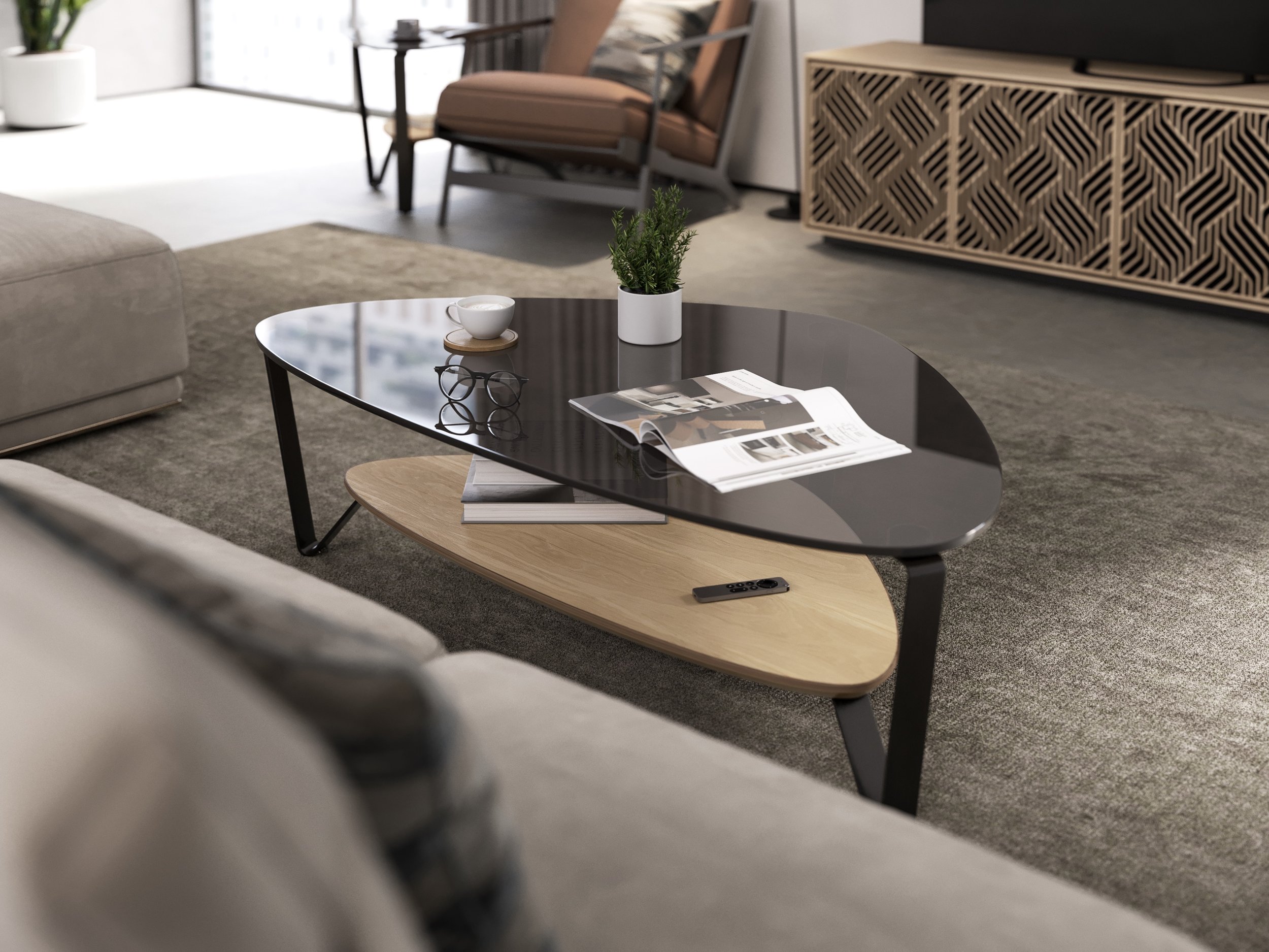 Modern living room with a black and beige coffee table, a white cup on a coaster, a small potted plant, glasses, an open magazine, and a remote control. In the background, there is a beige sofa, a wooden armchair, and a decorative cabinet.