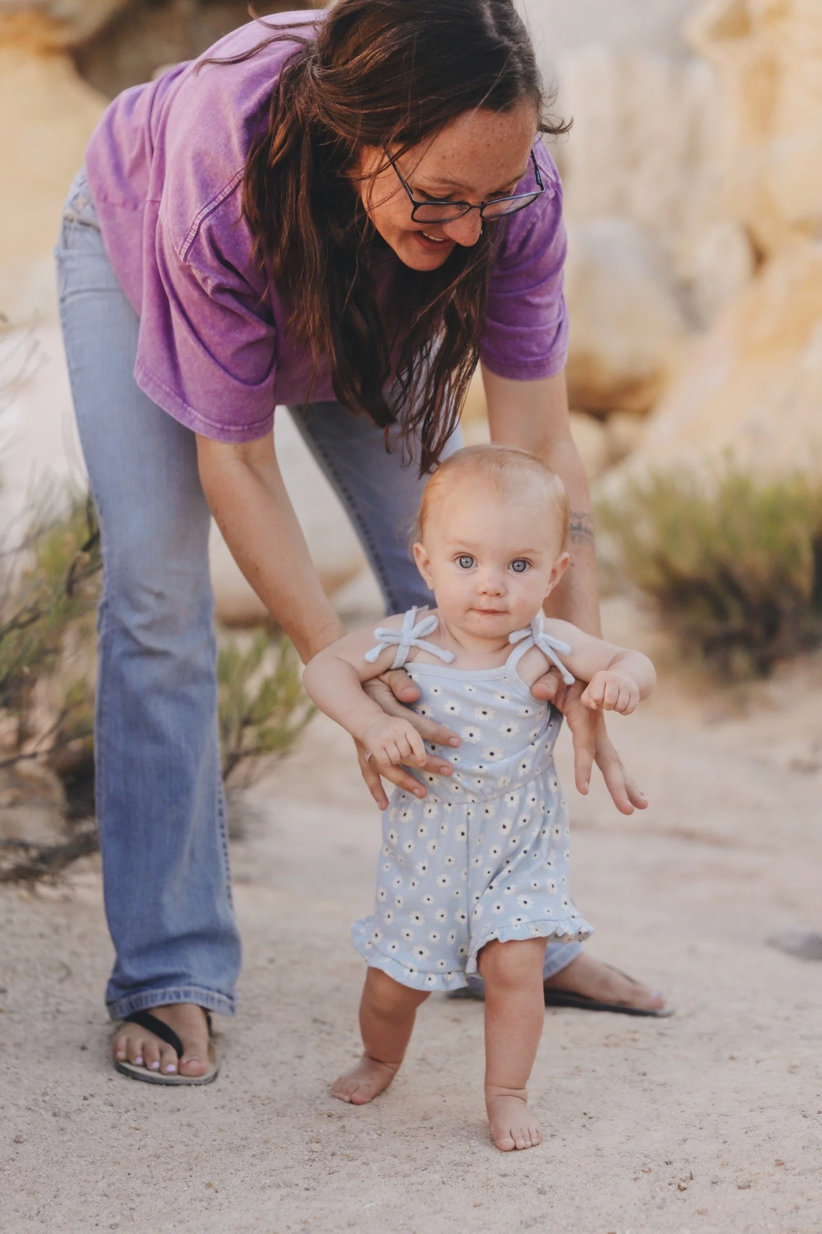 Dr. Rachel with young toddler, learning to walk - taken by Kate Barkley creative