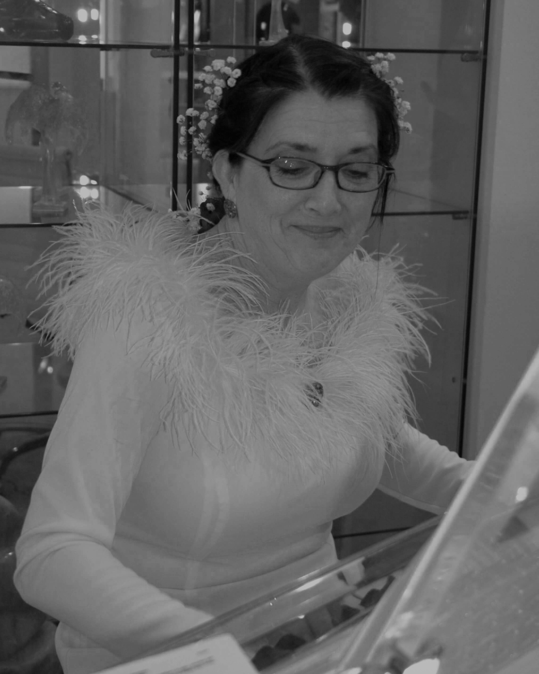 woman in fancy outfit playing the piano