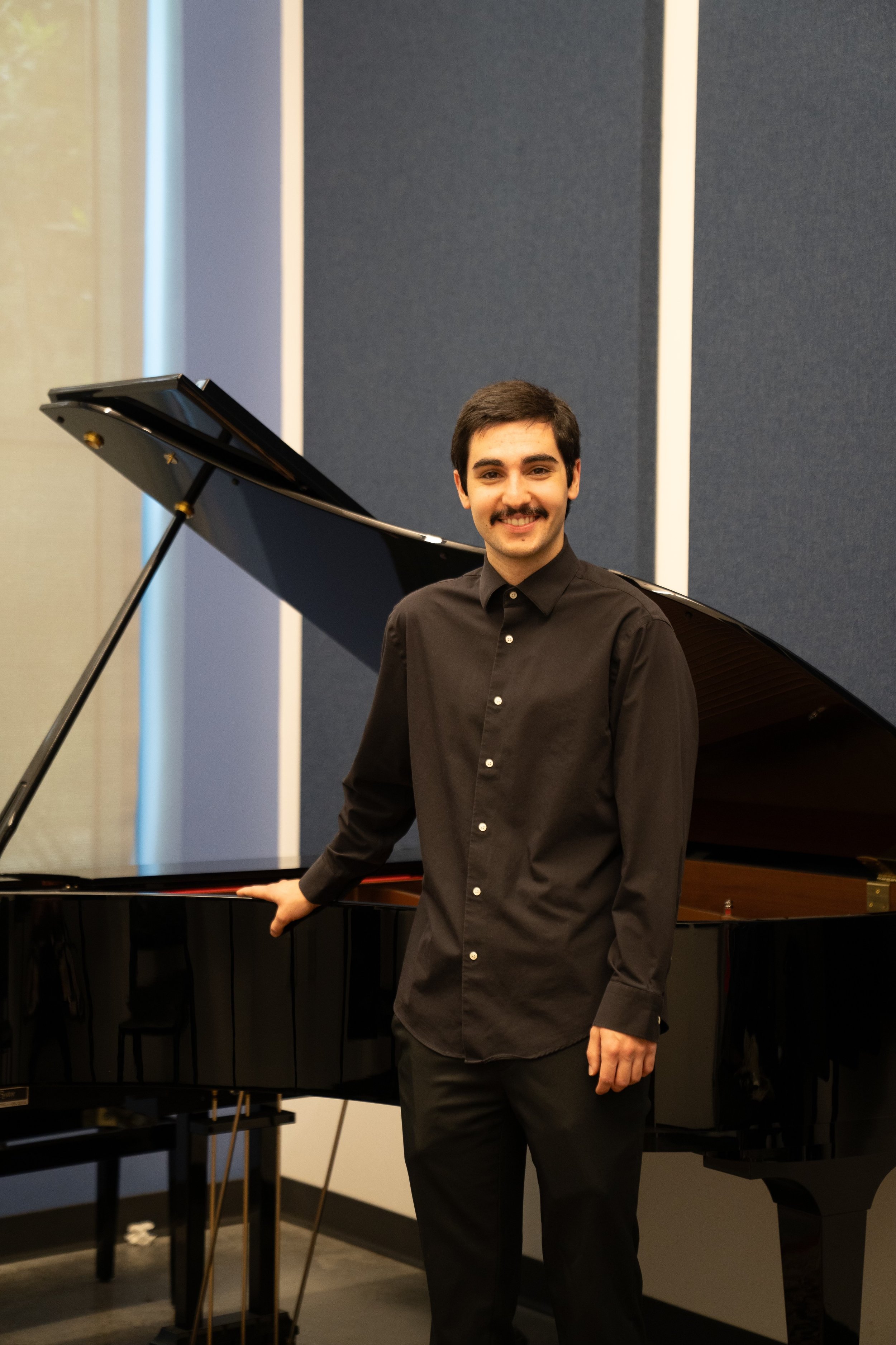 Young man with his piano, teaching