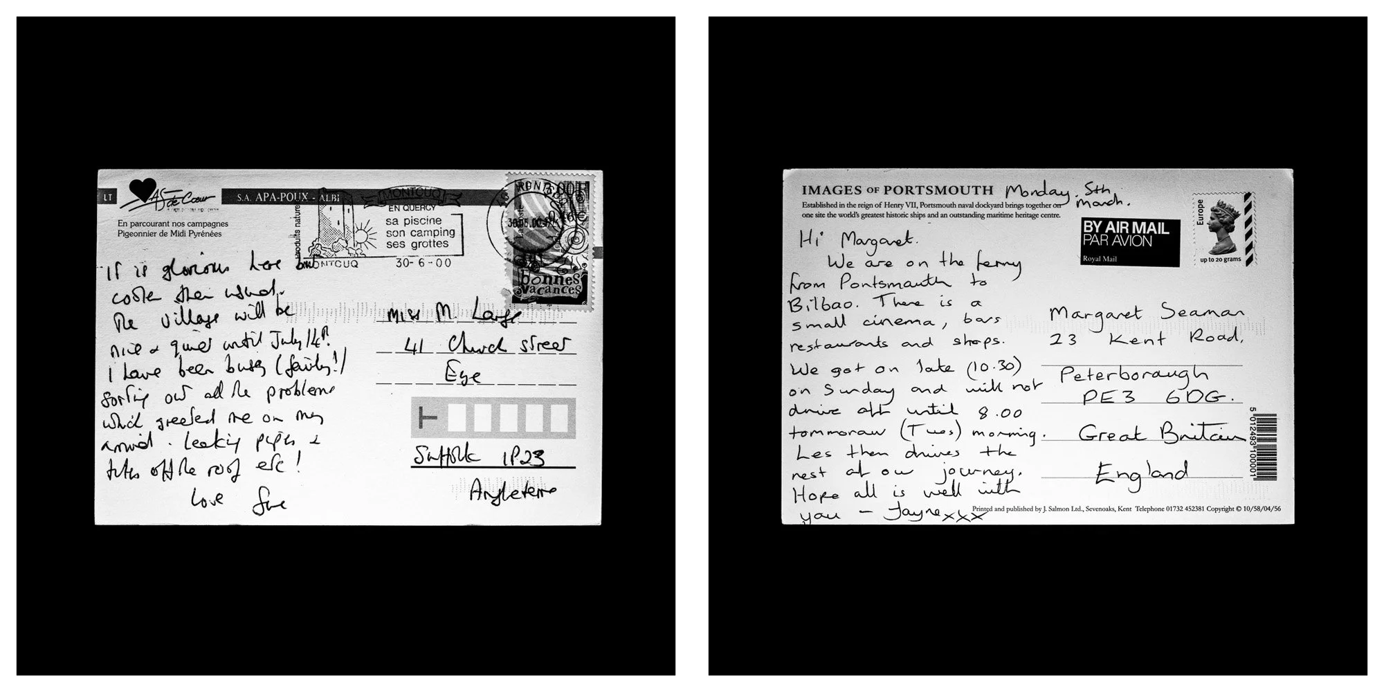 A forensic photographic capture displaying the reverse sides of two historical postcards positioned side-by-side against an absolute black space. Part of a systematic cataloging protocol, the image isolates the artifacts to treat handwriting, postal 