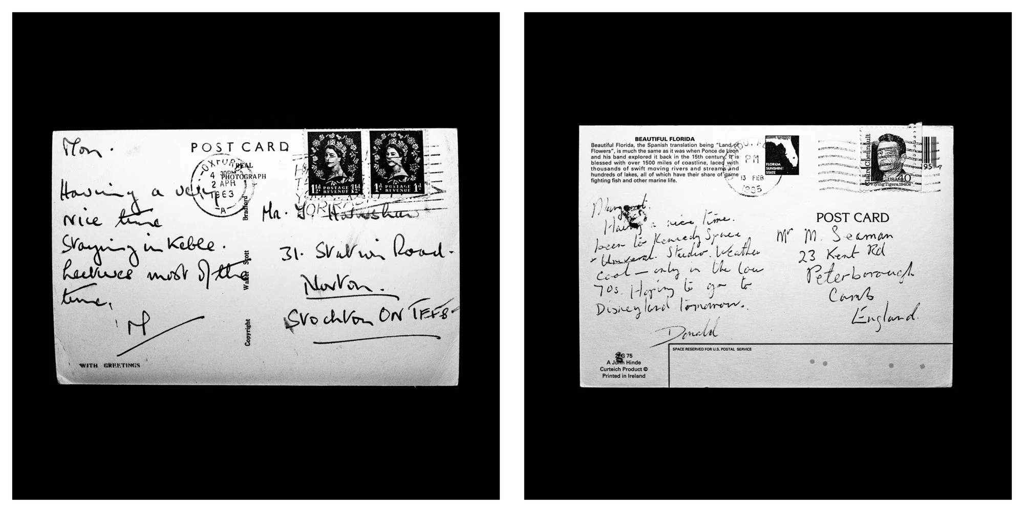 A forensic photographic capture displaying the reverse sides of two historical postcards positioned side-by-side against an absolute black space. Part of a systematic cataloging protocol, the image isolates the artifacts to treat handwriting, postal 