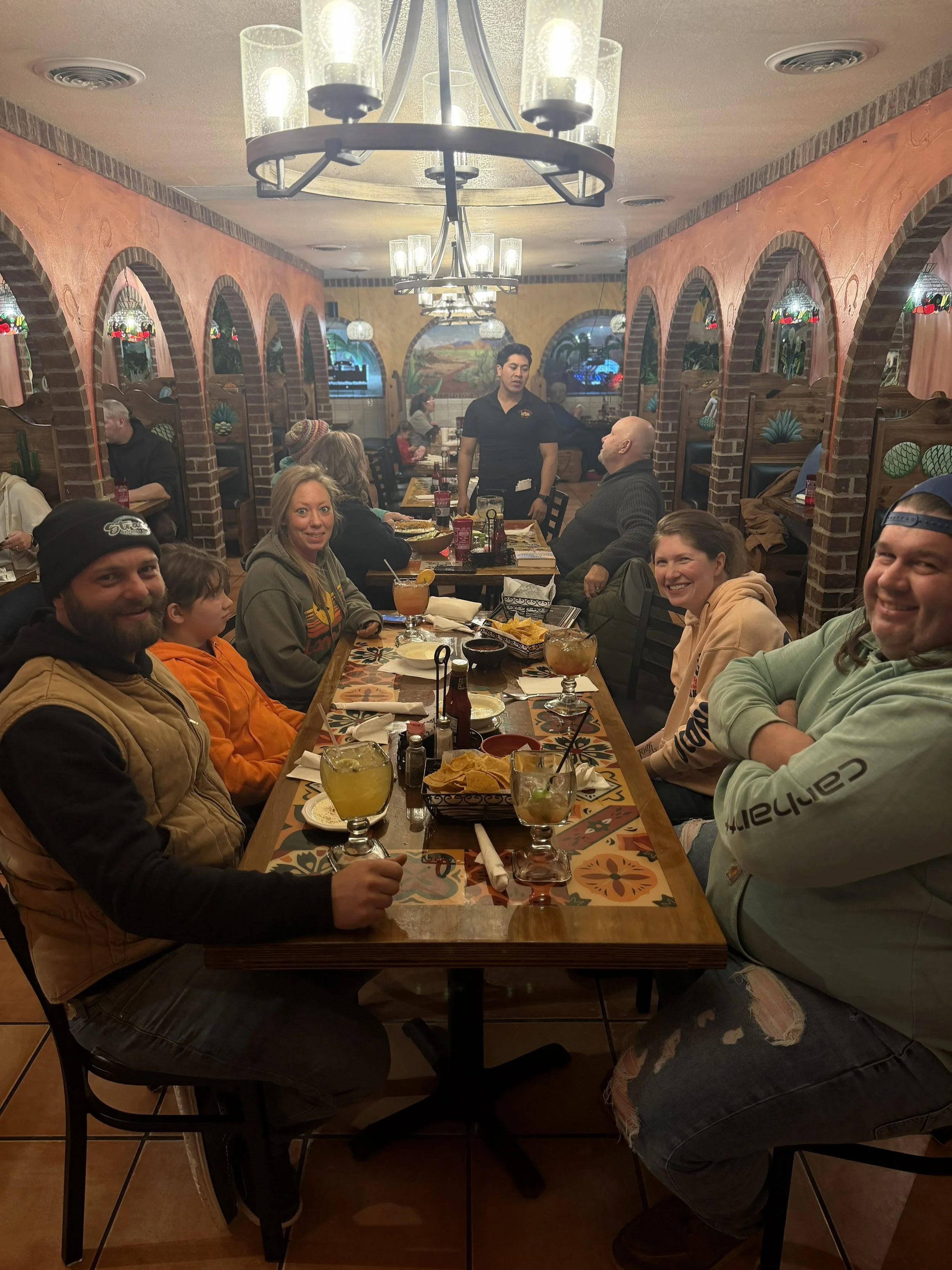 Group of friends dining together at a Mexican restaurant with flavorful meals, tasty margaritas, and a lively atmosphere. Gather with your friends and family for a mini vacation to Mexico right here in Rice Lake, WI!