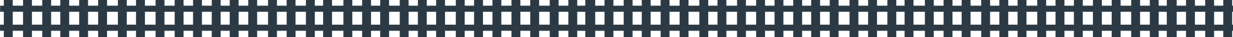 A view of a black plastic grid or vent with perforations.