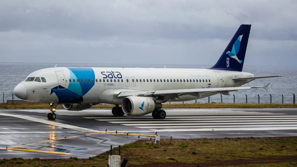 SATA airline plane on the runway at João Paulo II Airport in São Miguel, Azores.