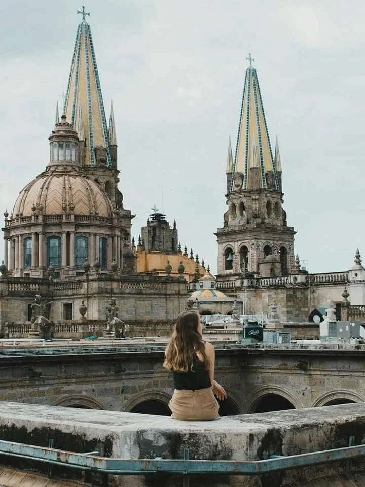 woman with view of cathedral of Guadalajara Mexico