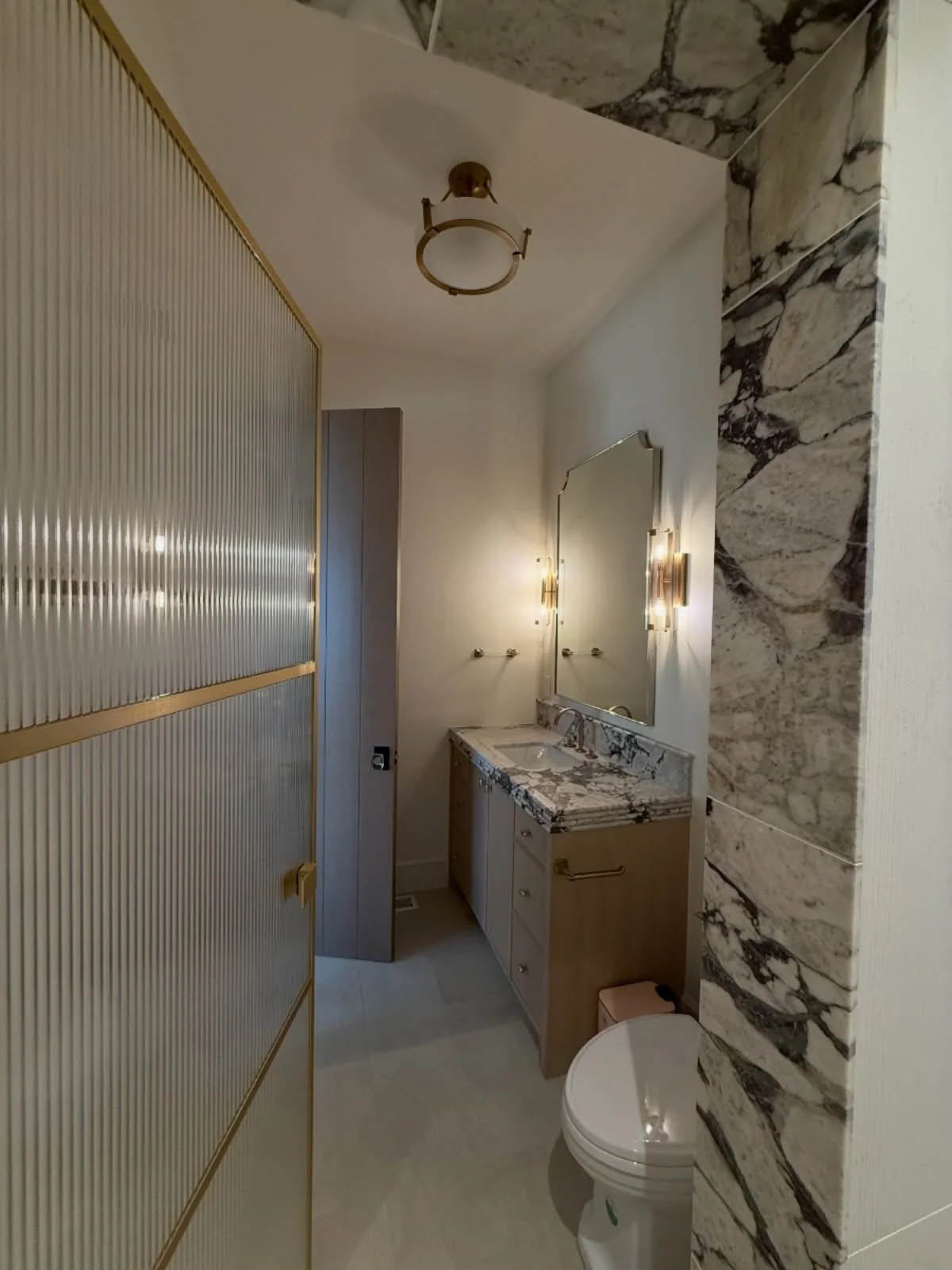 We don&rsquo;t showcase bathrooms enough! This bathroom really turned out special. The countertop and shower door are so cool! #bath #interiordesign #architecture #luxury