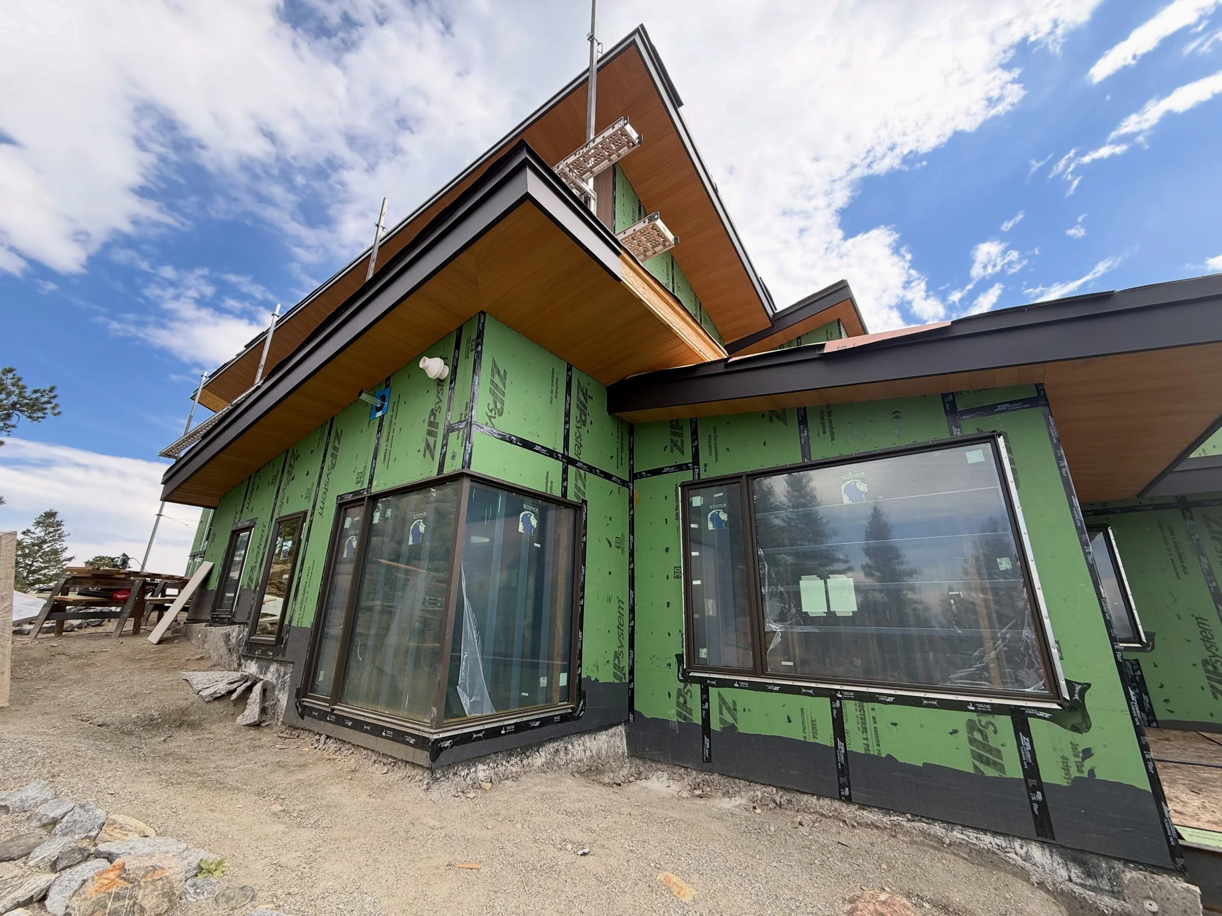 Our cliffside project is moving right along! We are currently installing windows, doors, siding, soffit and fascia! Next up is masonry! #customhome #luxurylifestyle #heart #architecture