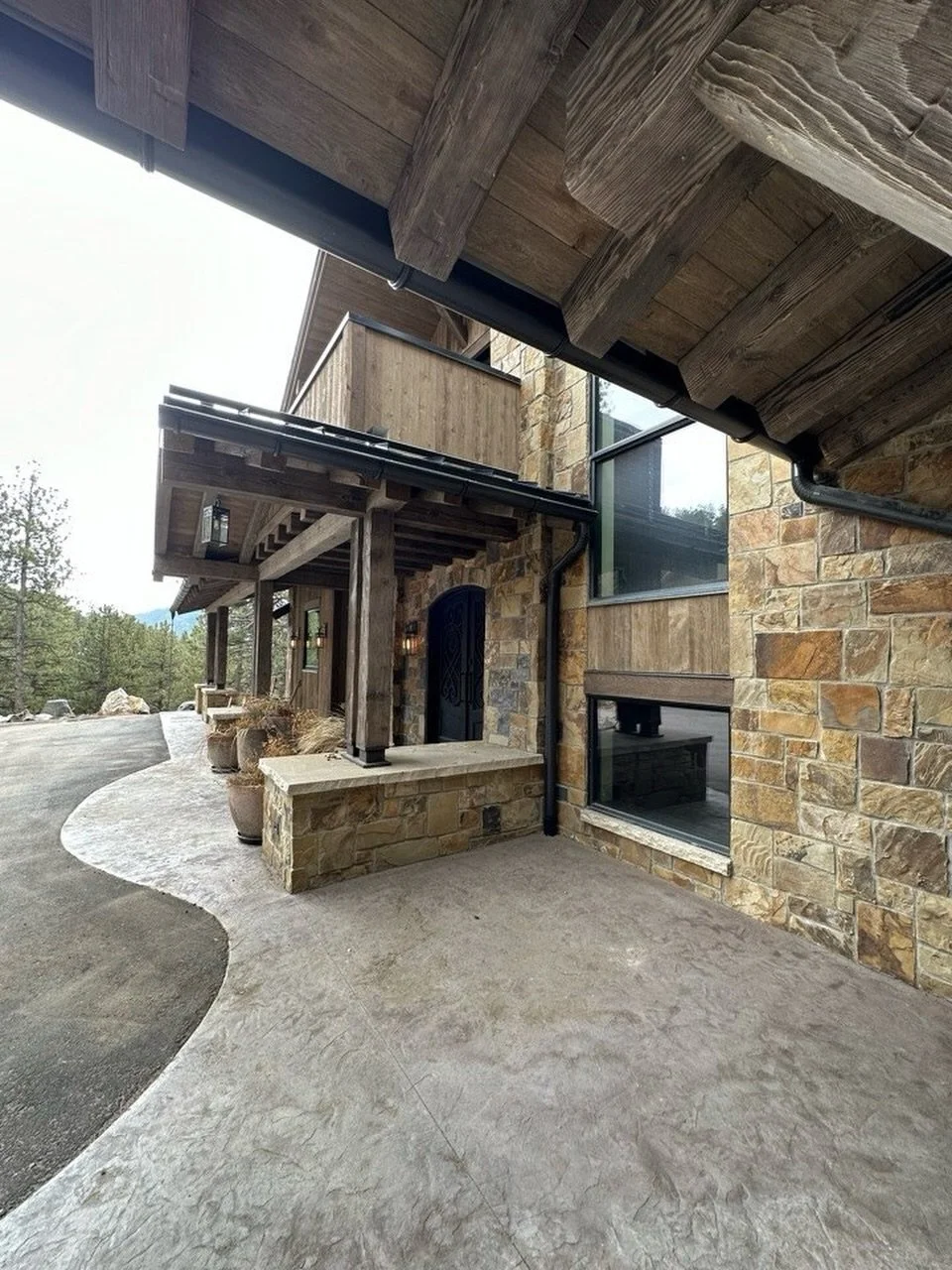 Timbers, stone and siding oh my!  There is something about building in the mountains with natural materials! #stone #evergreen #stone #luxuryhomes