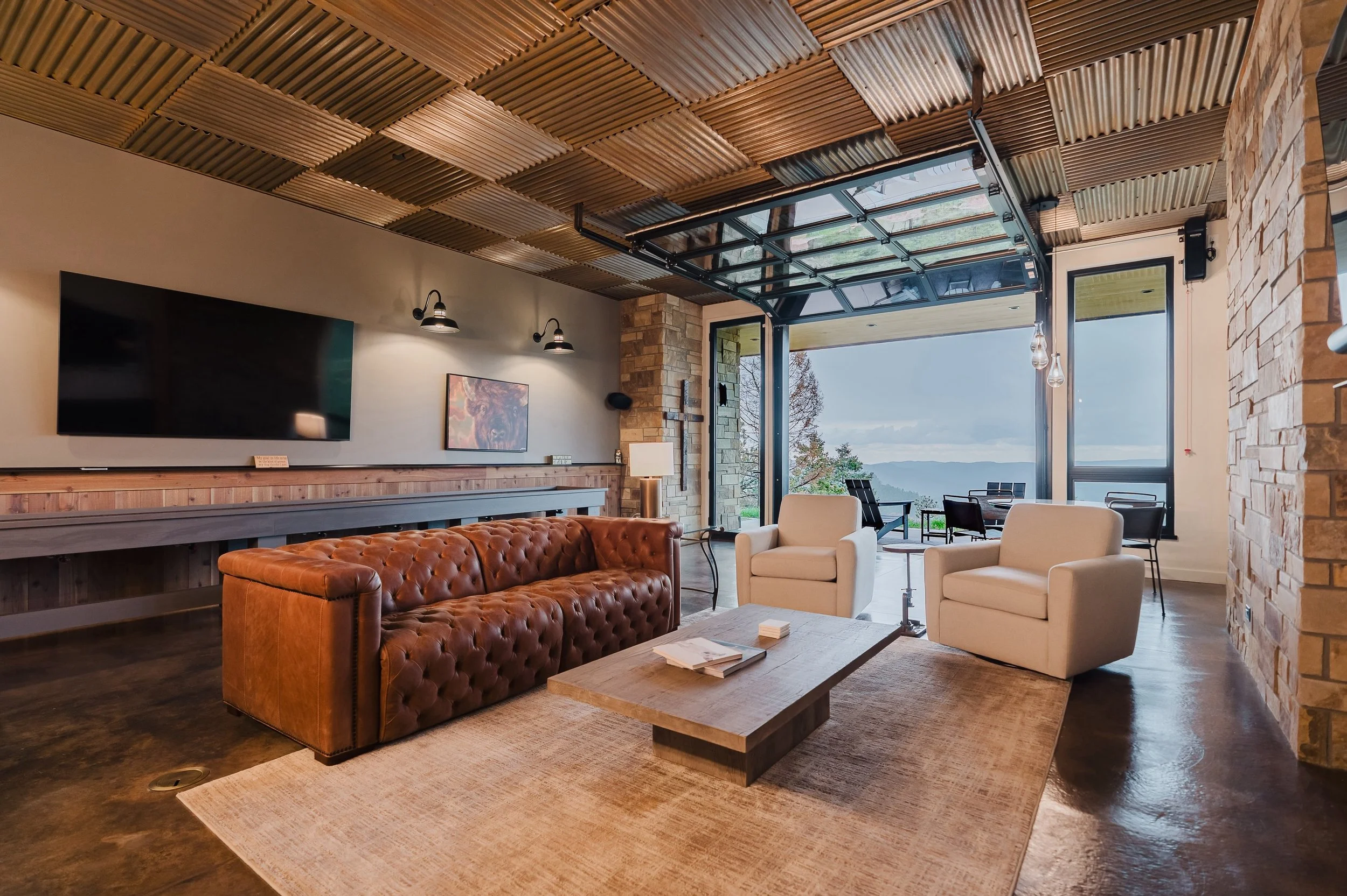 Welcome to Tavern On The Ridge! This space is one of a kind and the perfect place to enjoy football this weekend. The space features coreten panels, acid stained concrete floors, a linear fireplace, a beautiful garage door, Telluride stone and more!!