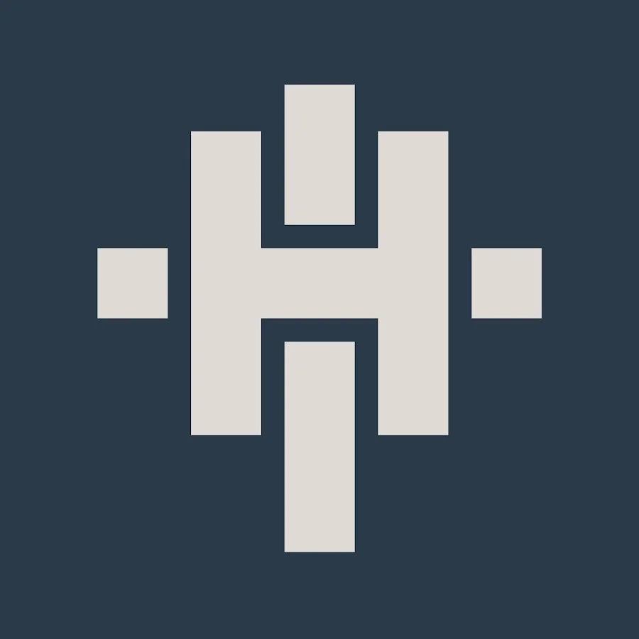 A pixelated, stylized letter 'H' with symmetrical blocks extending outward, on a dark blue background.