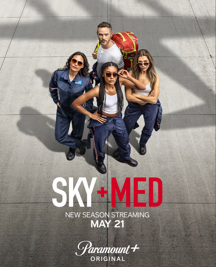Group of four diverse emergency responders, three women and one man, standing on a concrete surface. The women wear navy uniforms and sunglasses, and the man wears a white shirt with a red backpack. The text on the image advertises the new season of 'Sky + Medical' streaming on May 21, an original show by Paramount+.