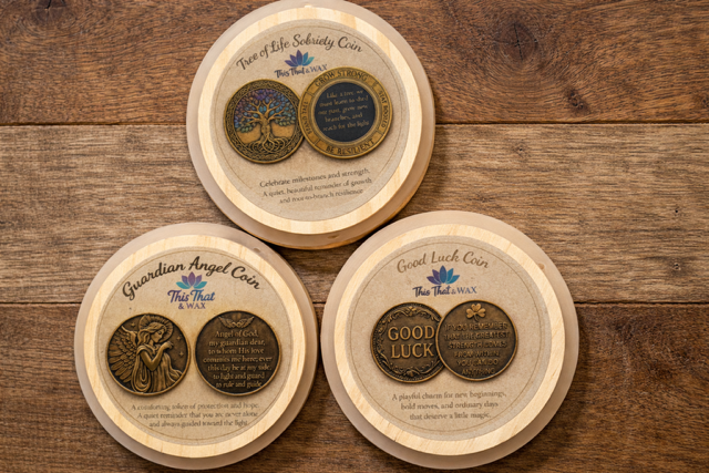 Three This That & Wax in a black matte jar with wooden lid, shown with the surprise Tree of Life sobriety coin beside it.