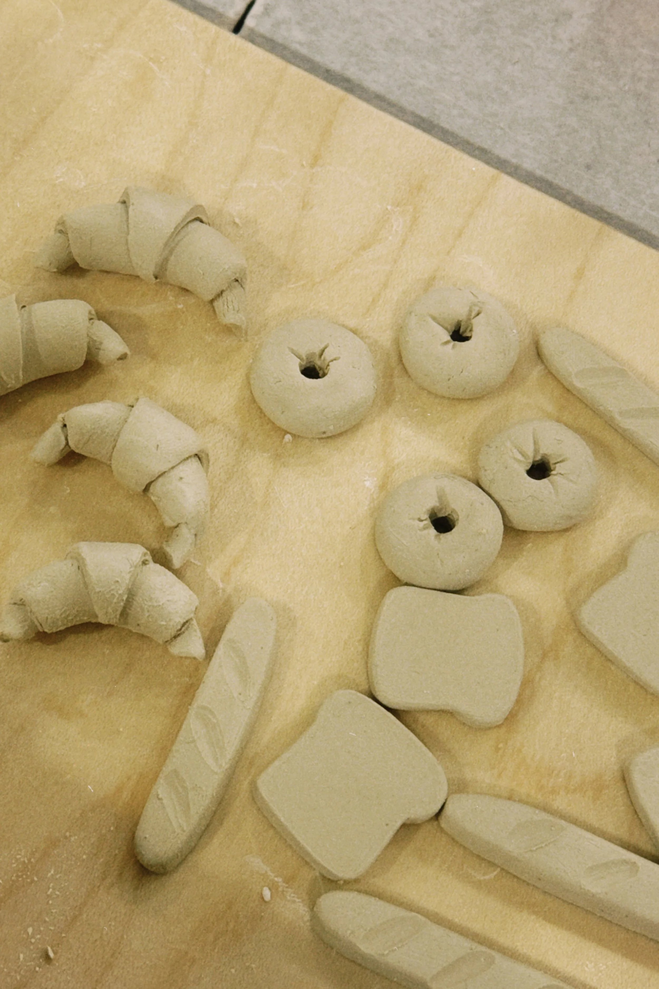 Mini decorative ceramic pastries made out of clay for surface decoration