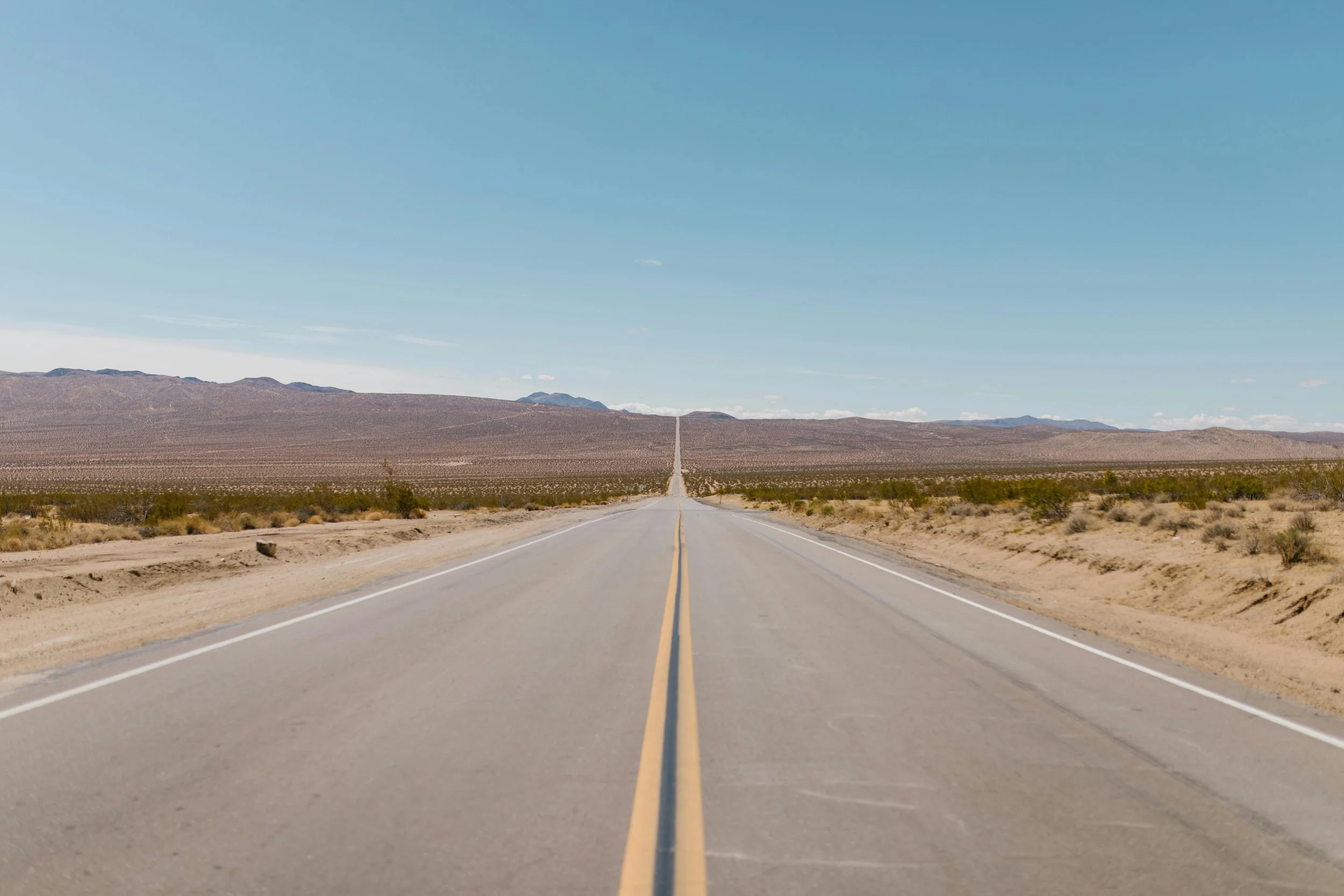 The A highway in the desert disappearing into the distance