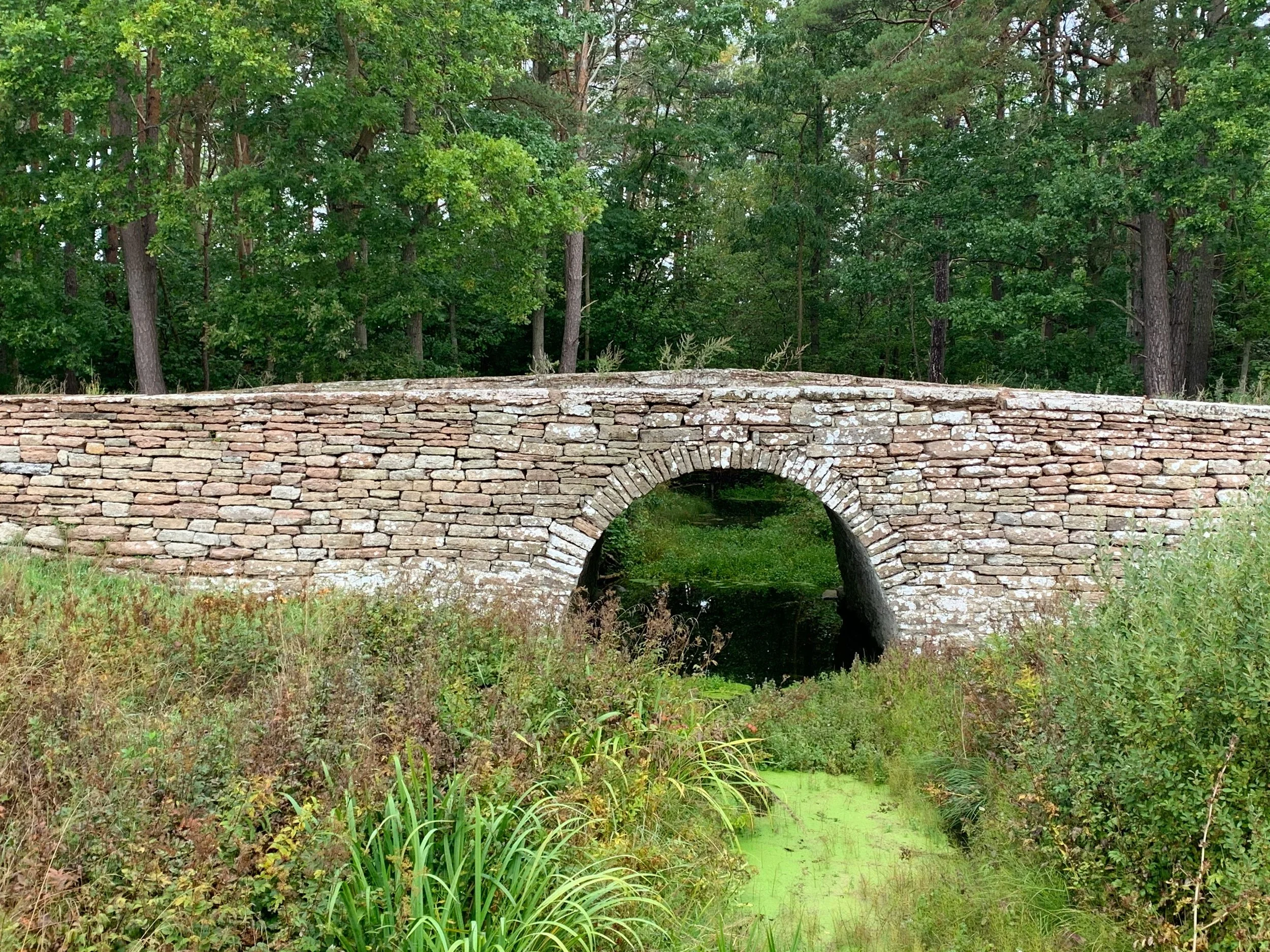 Old stone bridge over a stream