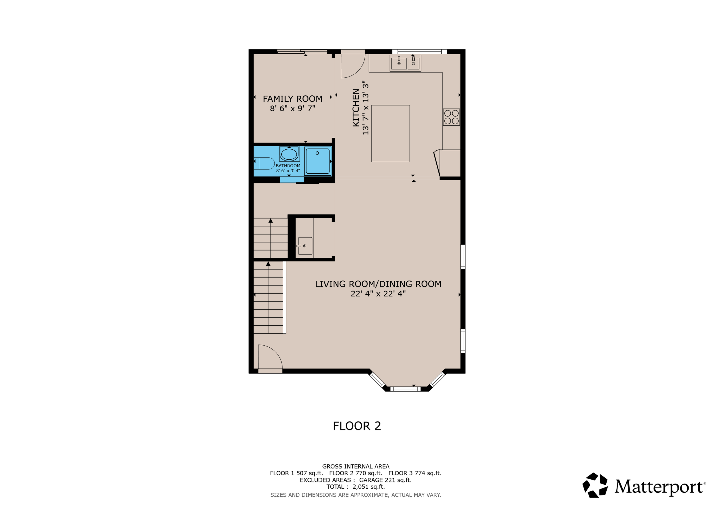 Floor plan of the second floor showing a living/dining room, kitchen, family room, bathroom, and stairs.