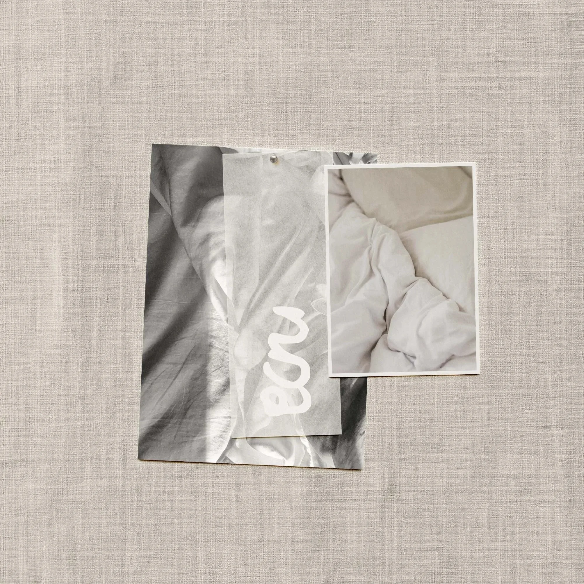 A piece of linen with images of bedsheets and a simple logo design.