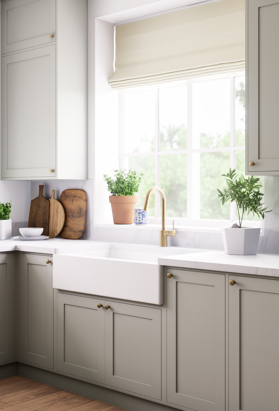 Tara Townsend Seattle real estate broker in modern kitchen with gray cabinets, farmhouse sink, and bright natural light