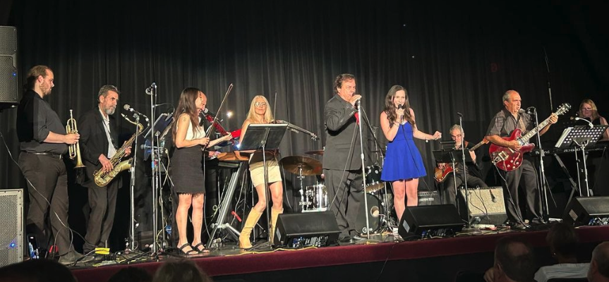 Rebecca performs in a Benefit Concert for Veterans as a Fourth of July Celebration.