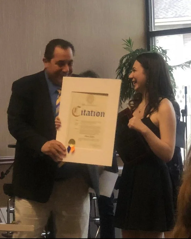 Rebecca receives the Marion Sager Youth Memorial Award.