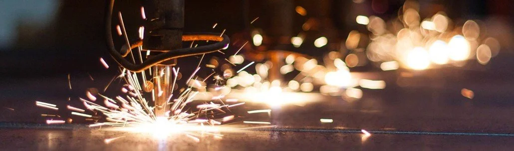 A welding process creating sparks on a metal surface.