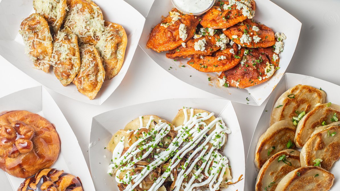 Variety of Mexican street food dishes including fried cheese-stuffed jalapeños, spicy chicken wings with blue cheese, pizza with toppings, cooked dumplings with sauce and garnish, and fried empanadas with green onions.