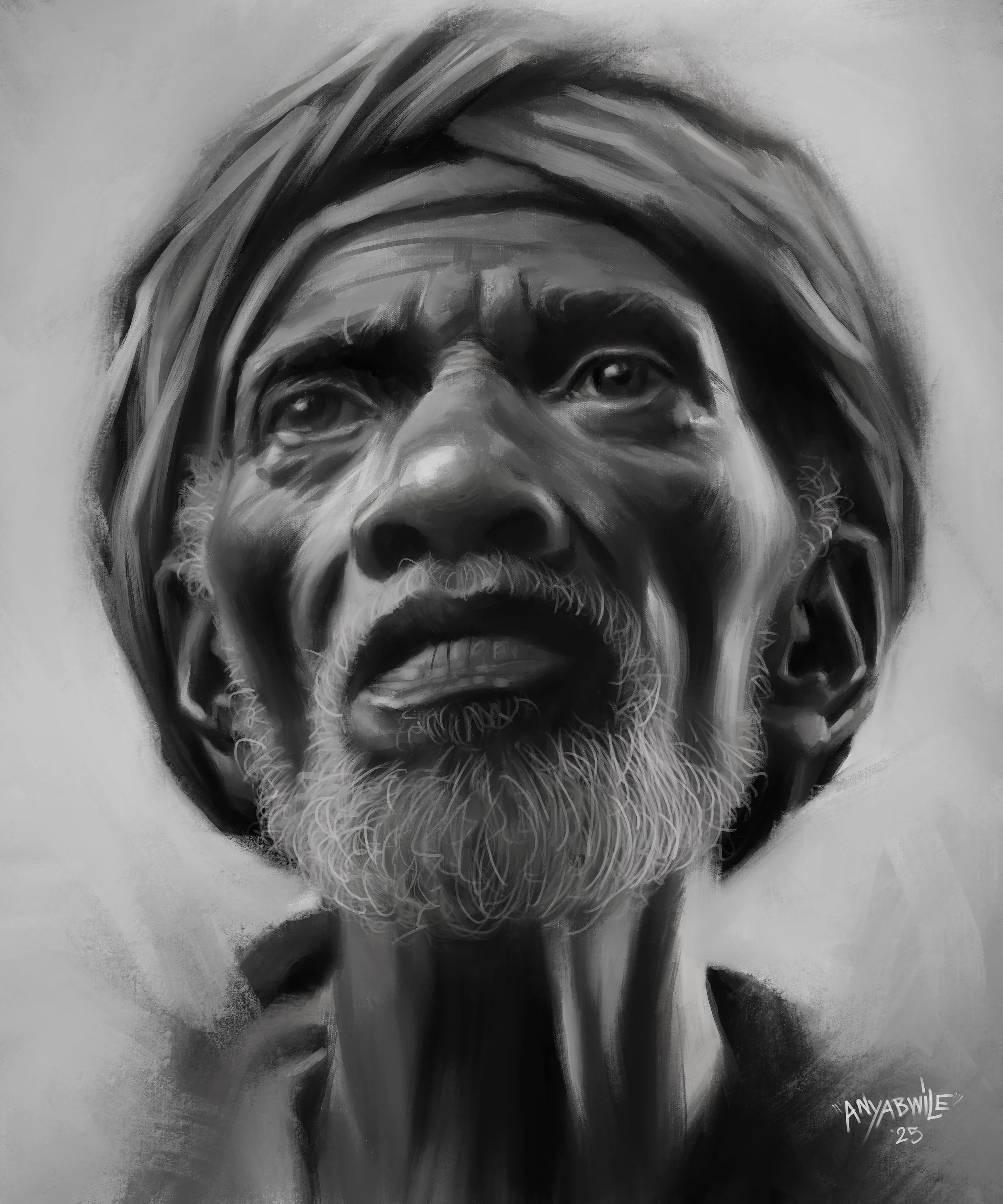 A black-and-white portrait of an elderly man with a turban and a beard, looking upwards.