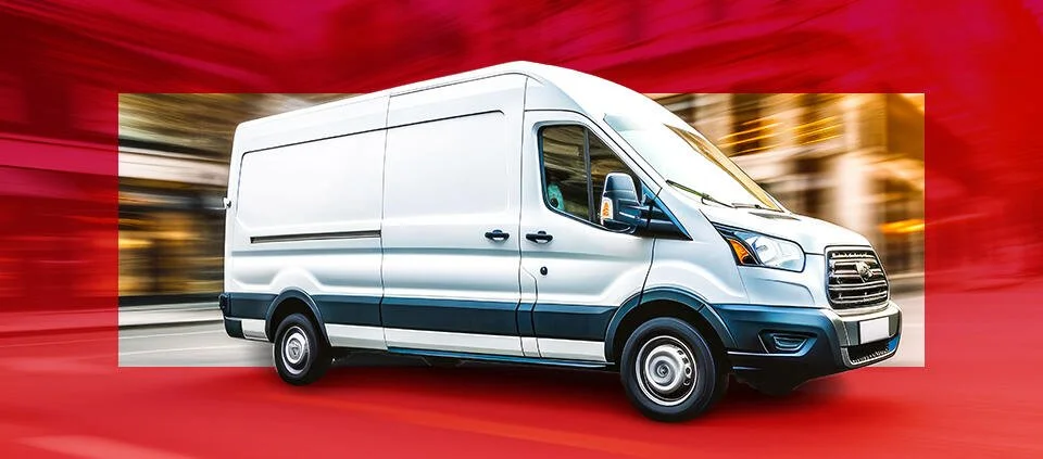 White cargo van driving on a city street with blurred background and a red overlay.